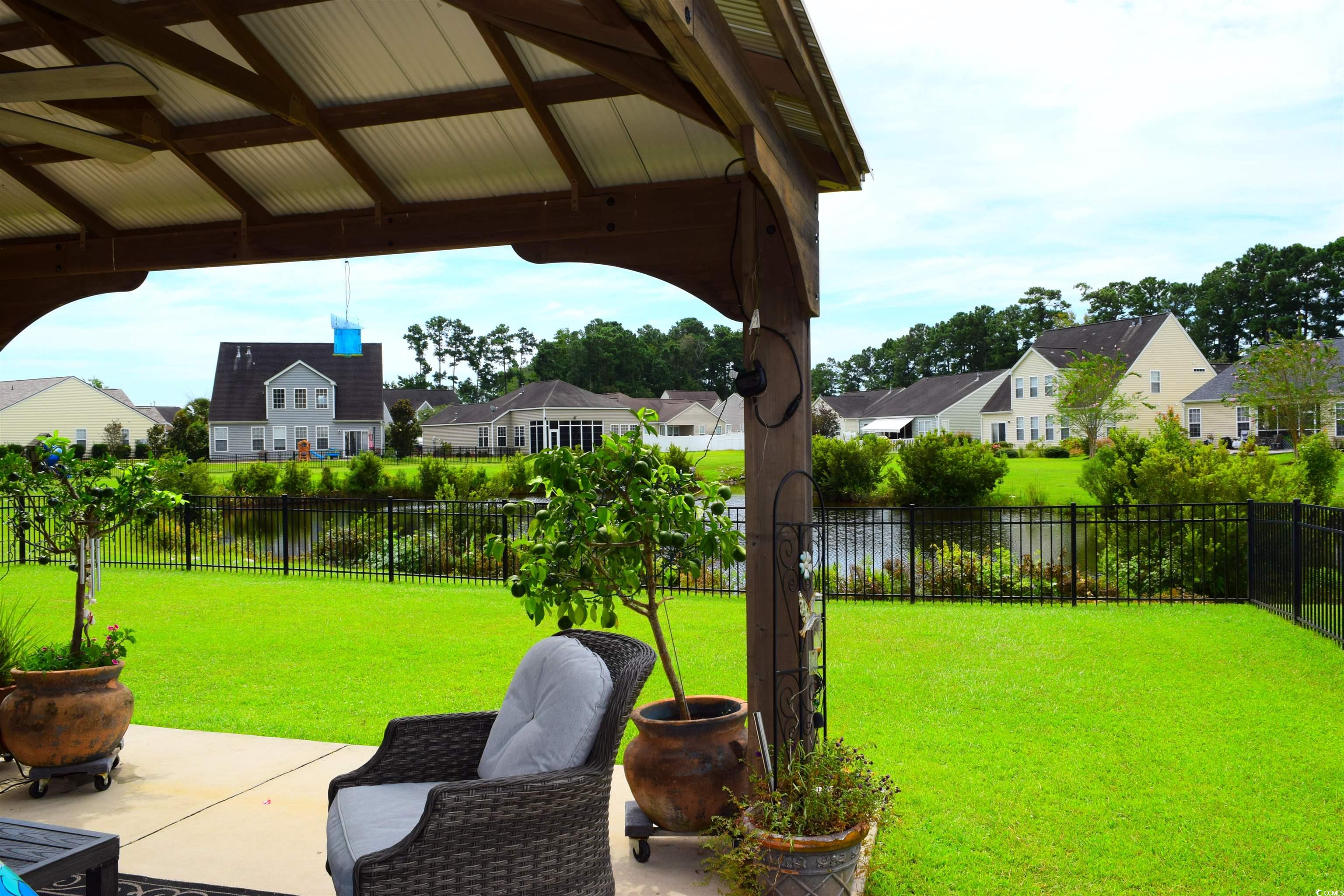 324 Oak Haven Drive Murrells Inlet, SC 29576 - Photo 37 of 38 Fenced backyard featuring a residential view and a patio area