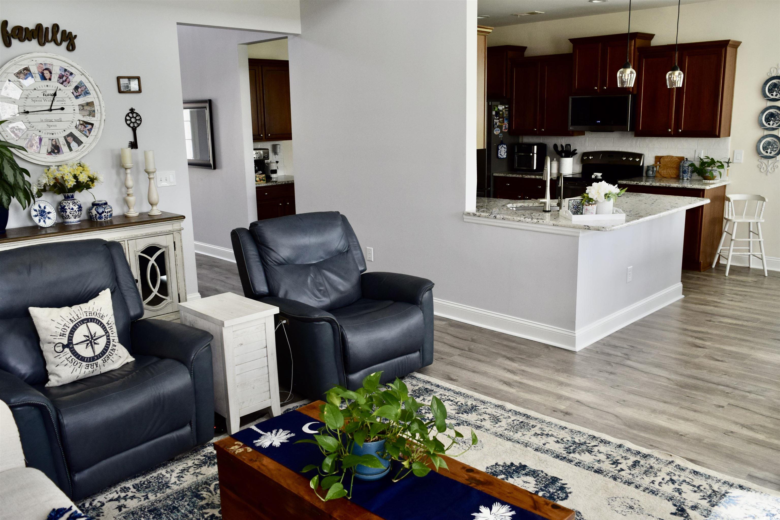 324 Oak Haven Drive Murrells Inlet, SC 29576 - Photo 6 of 38 Living area featuring light wood-style floors and baseboards