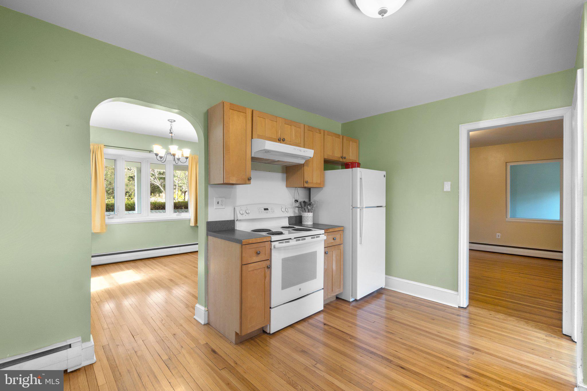 5718 Shookstown Road Frederick, MD 21702 - Photo 11 of 32 a kitchen with stainless steel appliances granite countertop a stove a sink and a refrigerator
