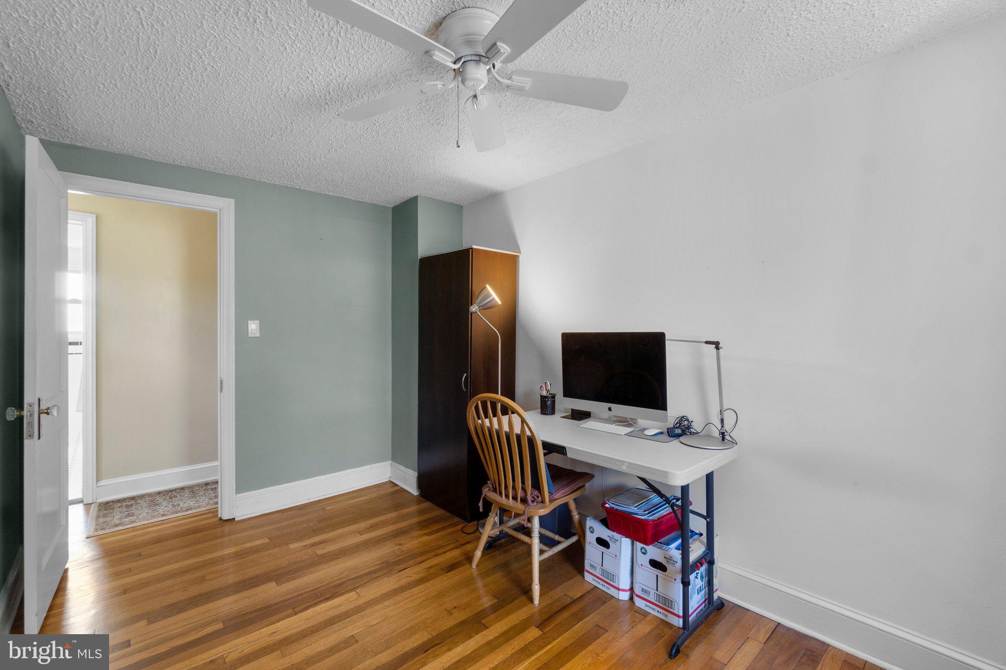 5718 Shookstown Road Frederick, MD 21702 - Photo 20 of 32 a view of a workspace with furniture and wooden floor