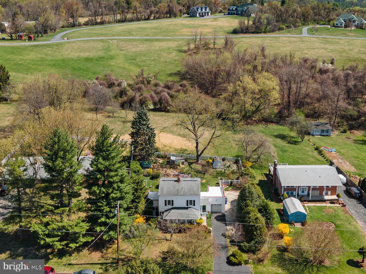 5718 Shookstown Road Frederick, MD 21702 - Photo 2 of 32 an aerial view of residential houses with outdoor space and trees