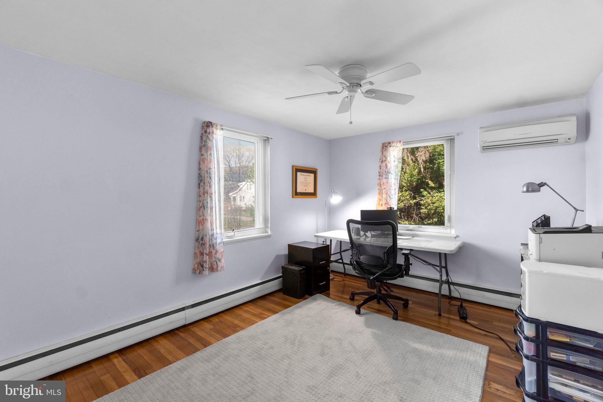 5718 Shookstown Road Frederick, MD 21702 - Photo 21 of 32 a view of a livingroom with workspace and a window