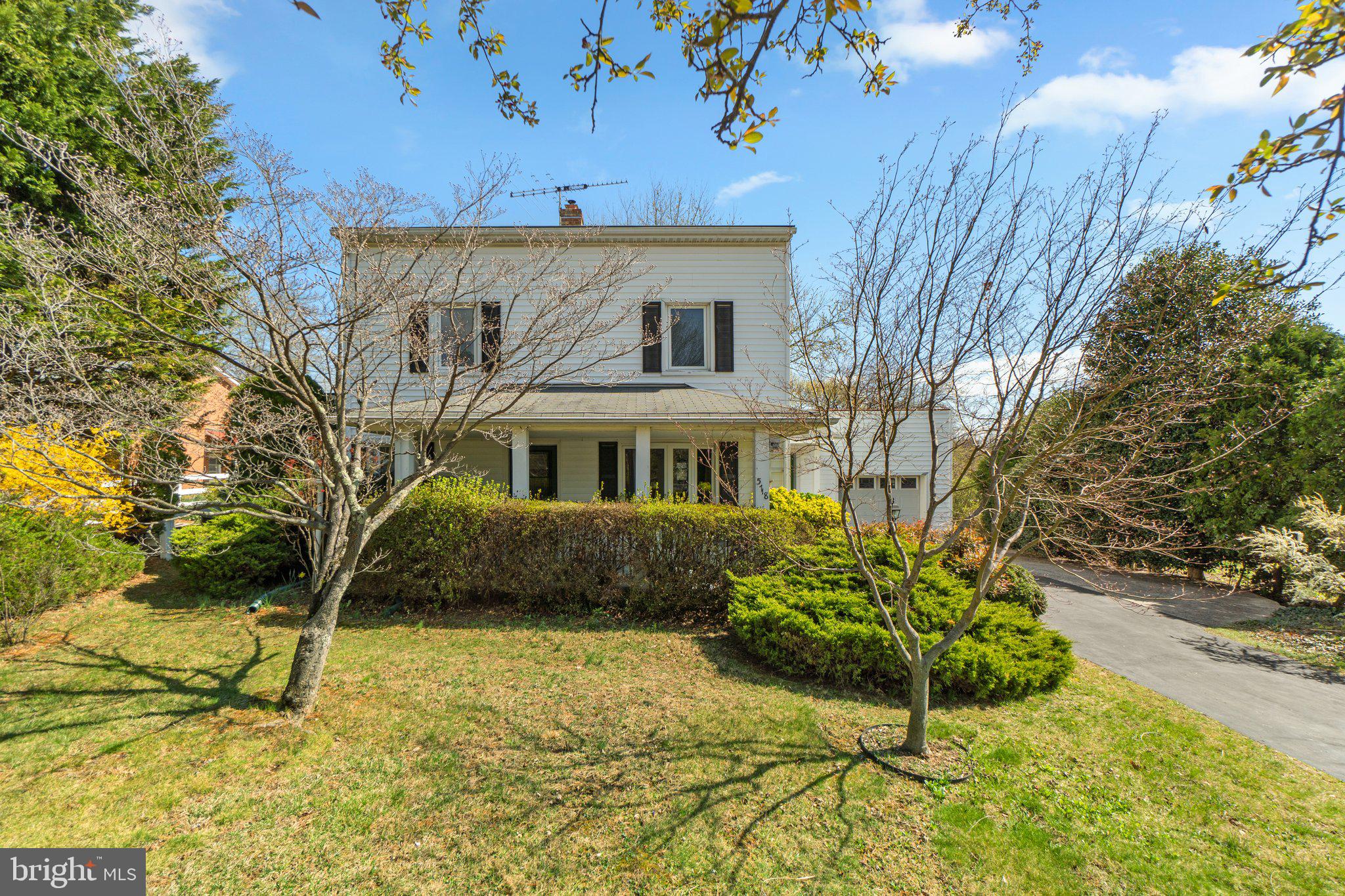 5718 Shookstown Road Frederick, MD 21702 - Photo 3 of 32 a front view of a house with a garden