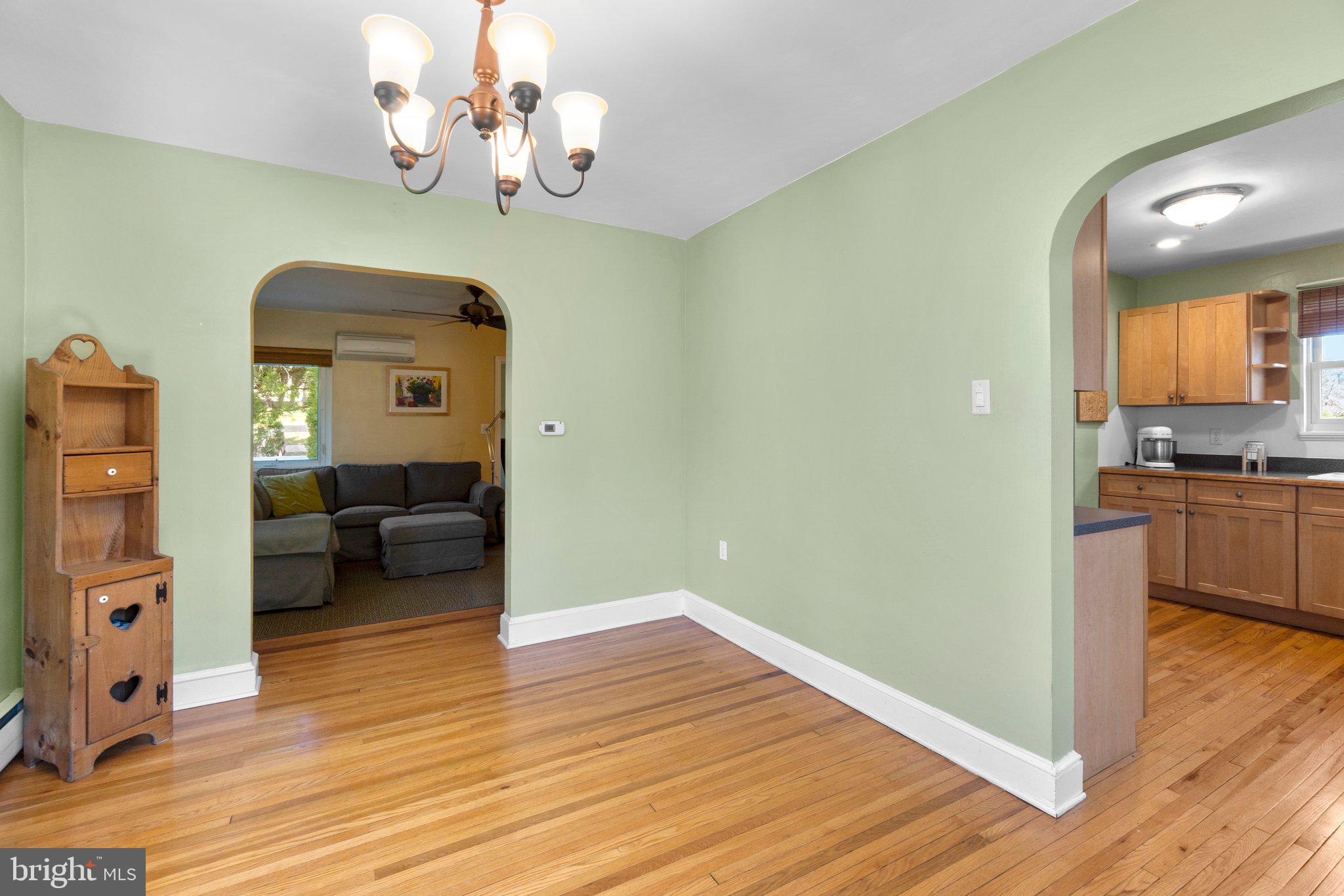 5718 Shookstown Road Frederick, MD 21702 - Photo 7 of 32 a living room with couches and wooden floor