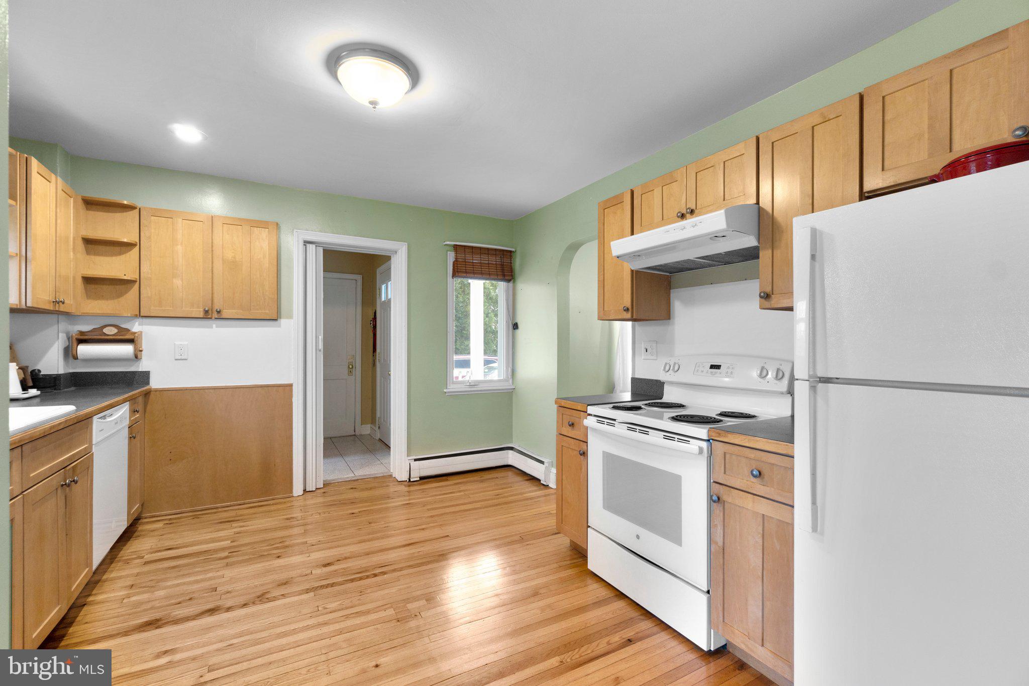 5718 Shookstown Road Frederick, MD 21702 - Photo 10 of 32 a kitchen with a stove a refrigerator and a sink