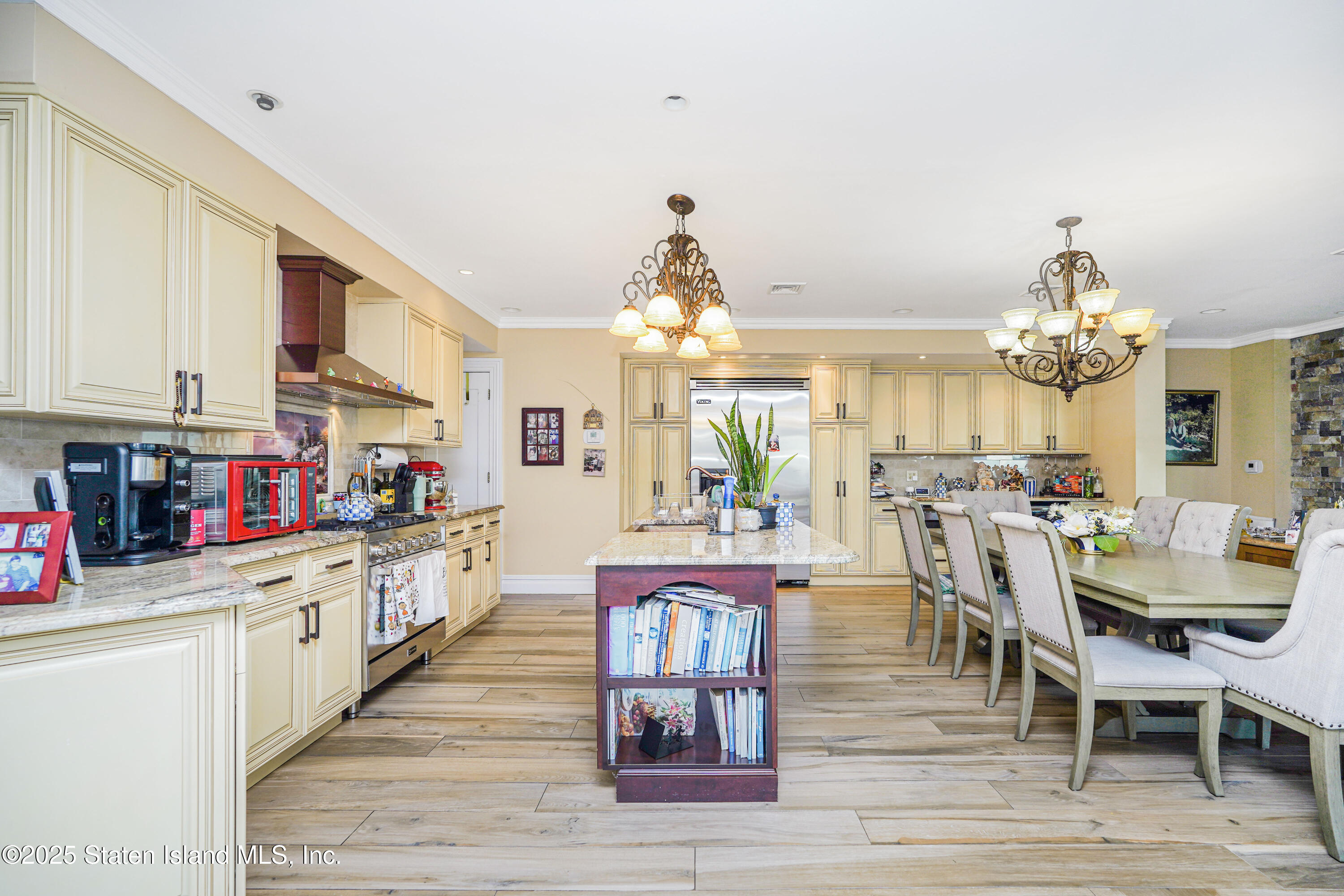 44 Zephyr Avenue Staten Island, NY 10312 - Photo 13 of 54 a large kitchen with lots of counter space and chandelier