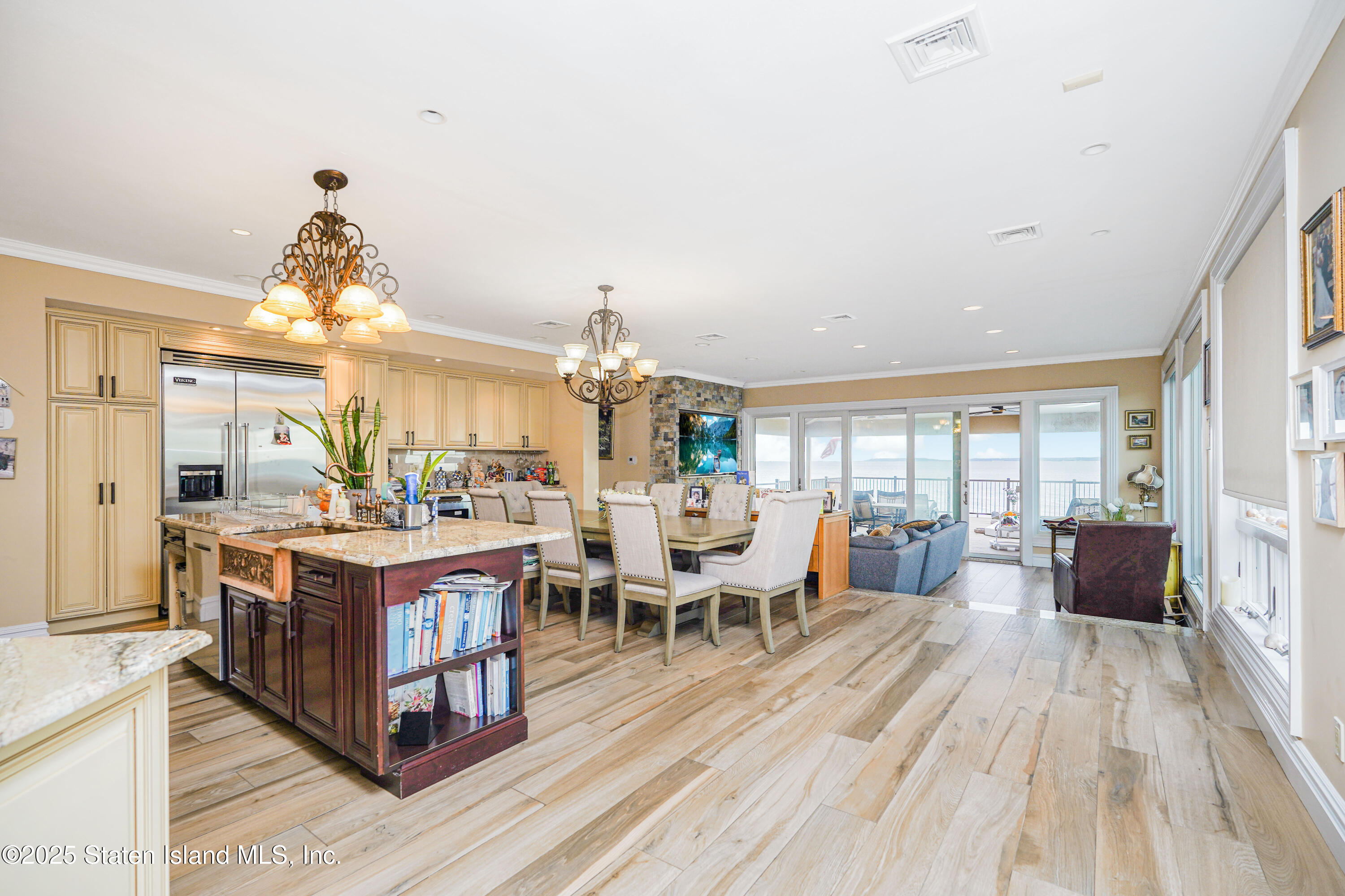 44 Zephyr Avenue Staten Island, NY 10312 - Photo 14 of 54 a living room with furniture windows and a chandelier