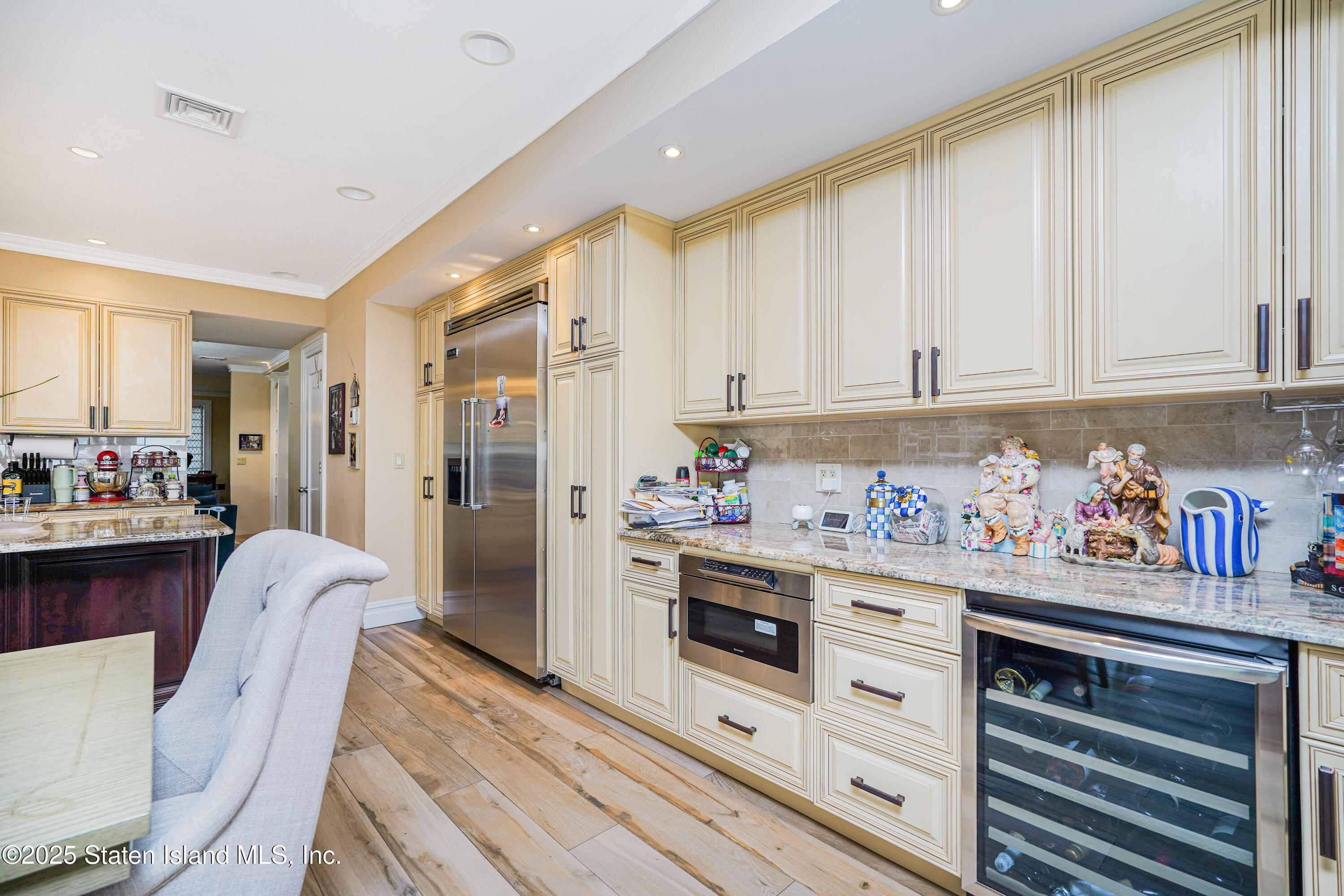 44 Zephyr Avenue Staten Island, NY 10312 - Photo 15 of 54 a kitchen with stainless steel appliances white cabinets and stove top oven