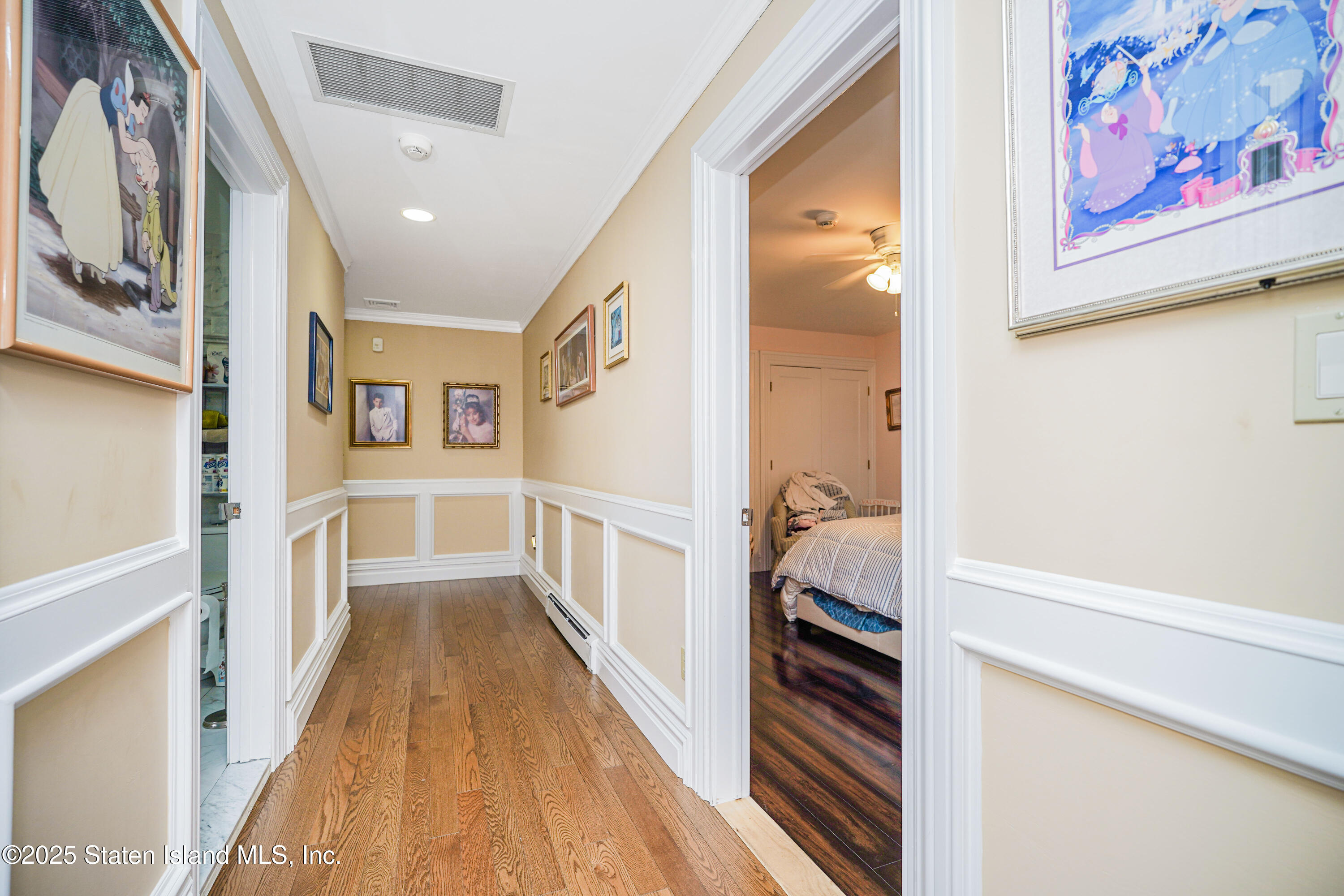 44 Zephyr Avenue Staten Island, NY 10312 - Photo 18 of 54 a view of hallway with stairs and wooden floor