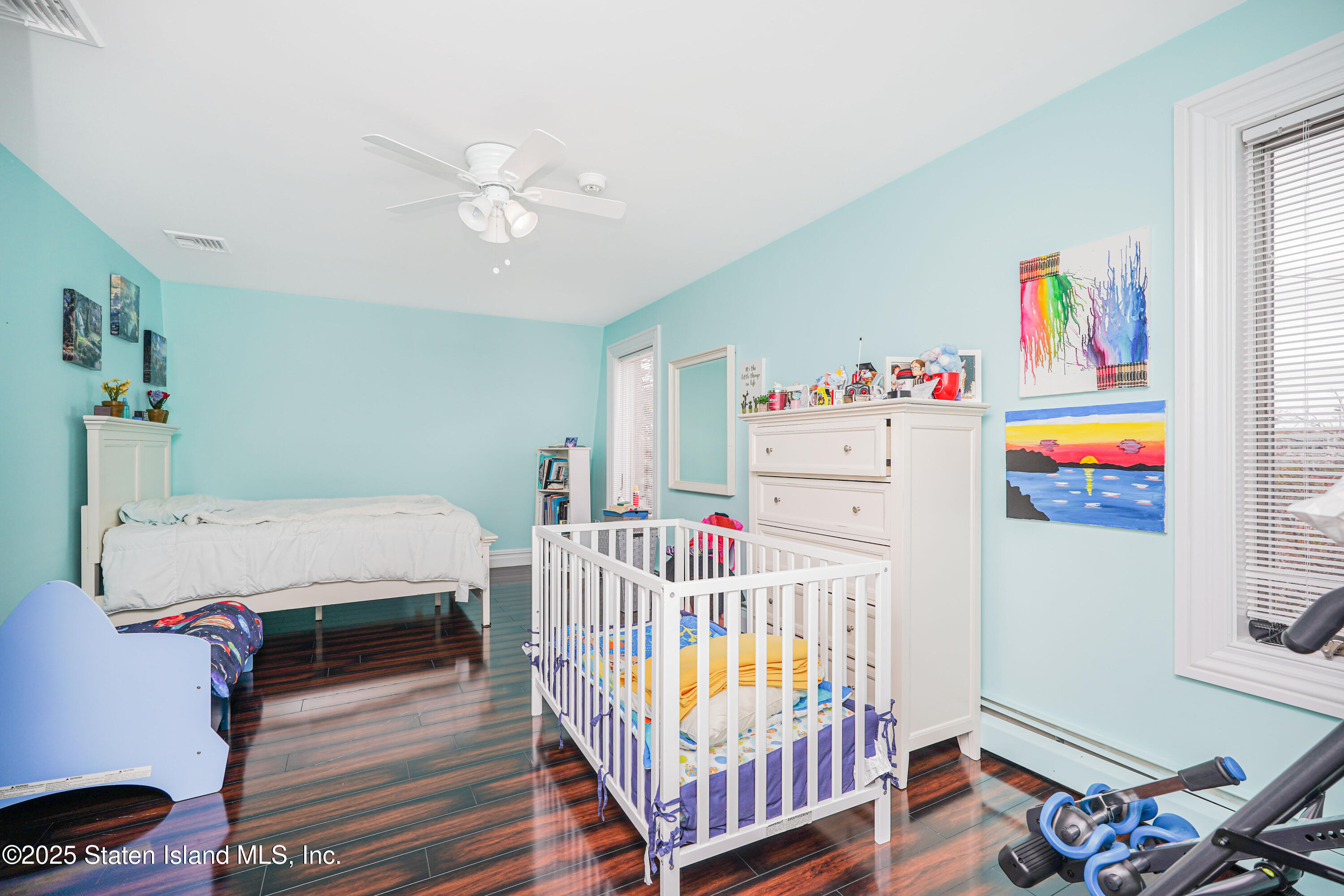 44 Zephyr Avenue Staten Island, NY 10312 - Photo 22 of 54 a bedroom with furniture a baby bed baby crib and a couch