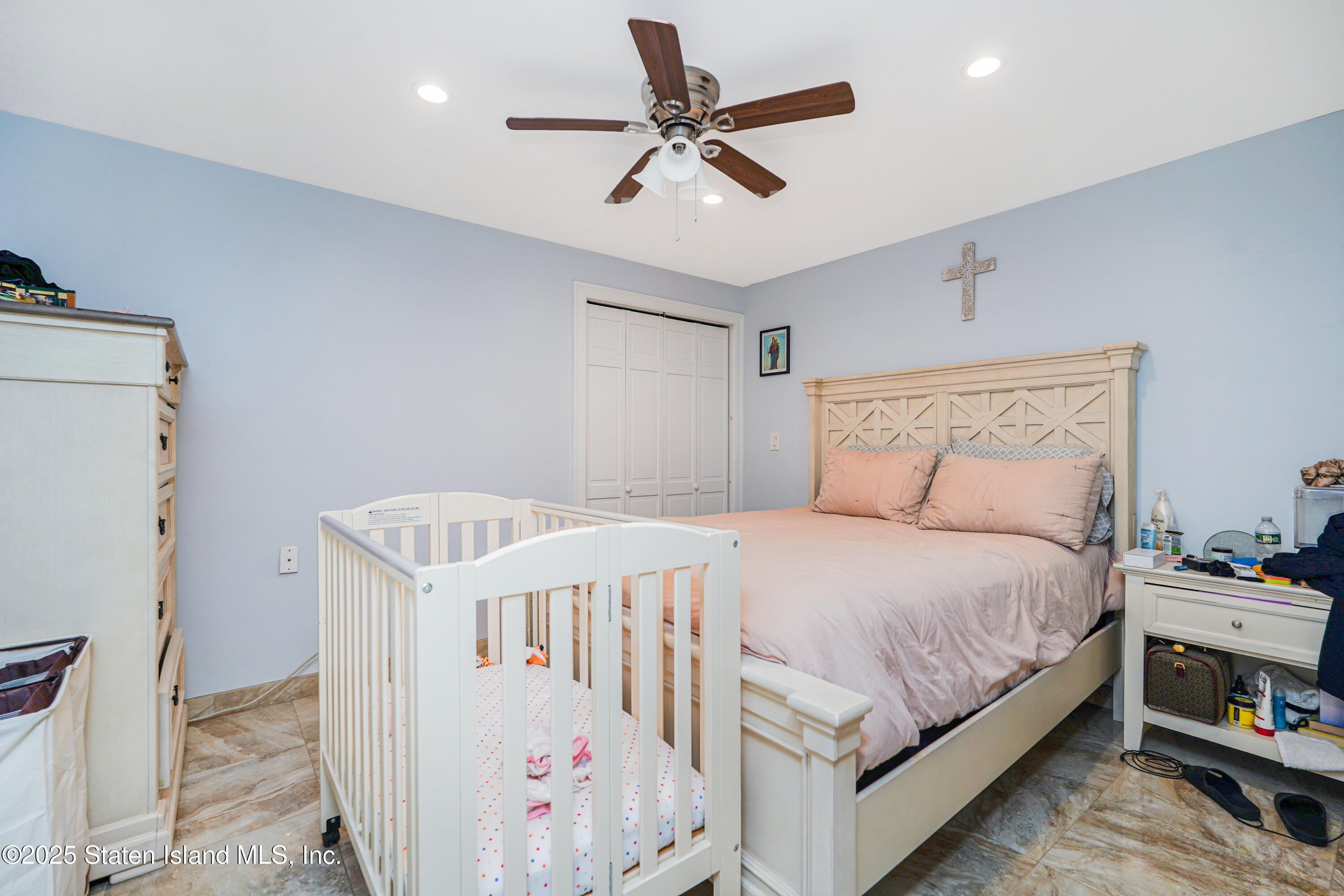44 Zephyr Avenue Staten Island, NY 10312 - Photo 23 of 54 a bedroom with a bed and a ceiling fan