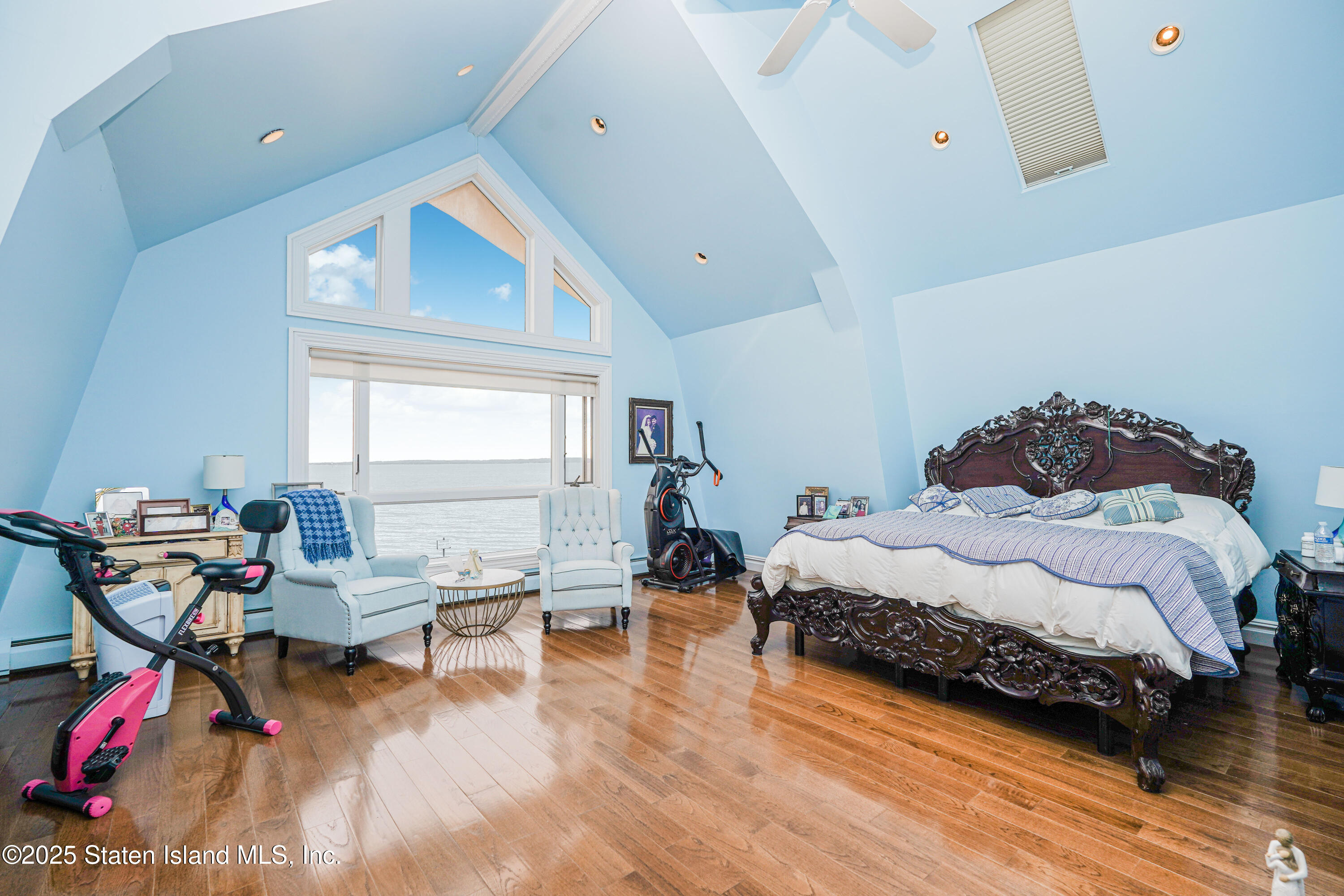 44 Zephyr Avenue Staten Island, NY 10312 - Photo 26 of 54 a bedroom with a bed and wooden floor