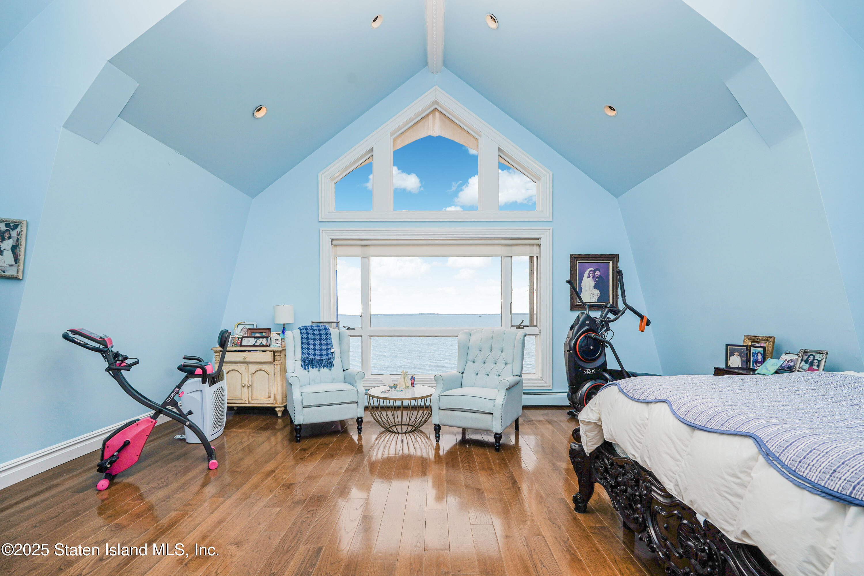 44 Zephyr Avenue Staten Island, NY 10312 - Photo 27 of 54 a bedroom with a bed and a wooden floor