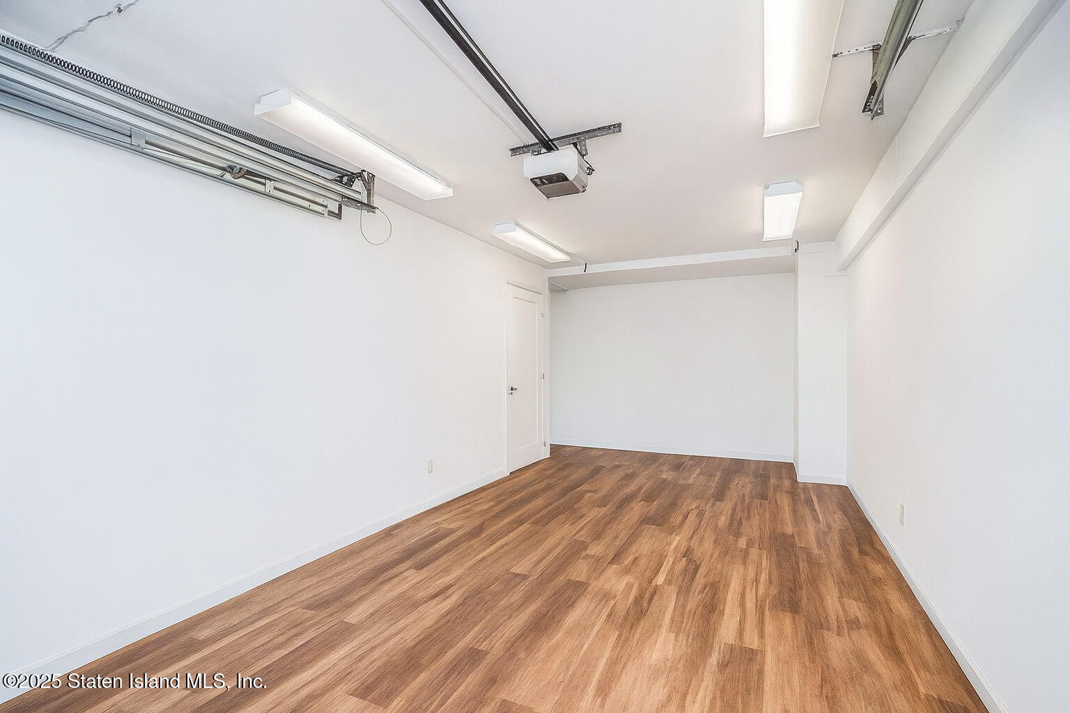 44 Zephyr Avenue Staten Island, NY 10312 - Photo 28 of 54 a view of a big room with wooden floor