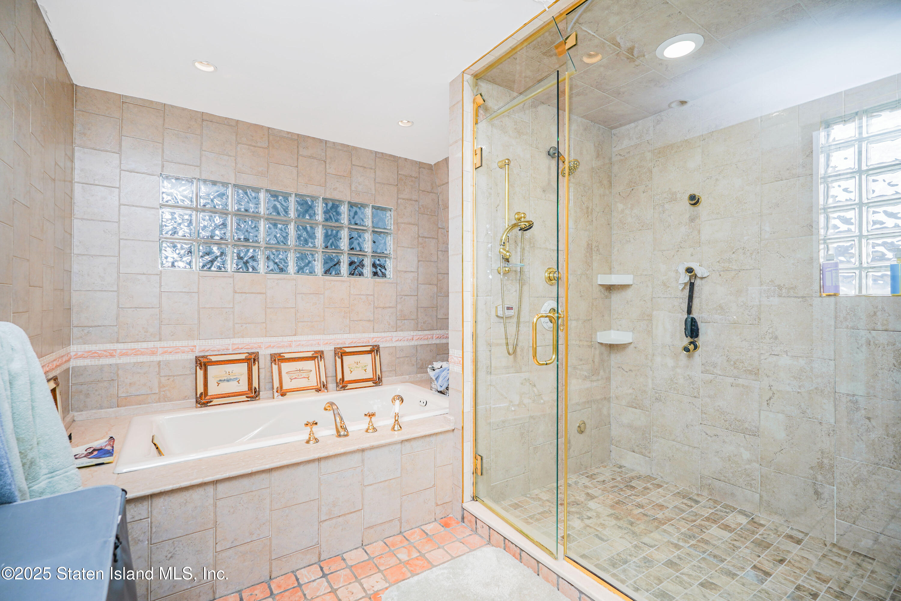 44 Zephyr Avenue Staten Island, NY 10312 - Photo 31 of 54 a bathroom with a bathtub and shower