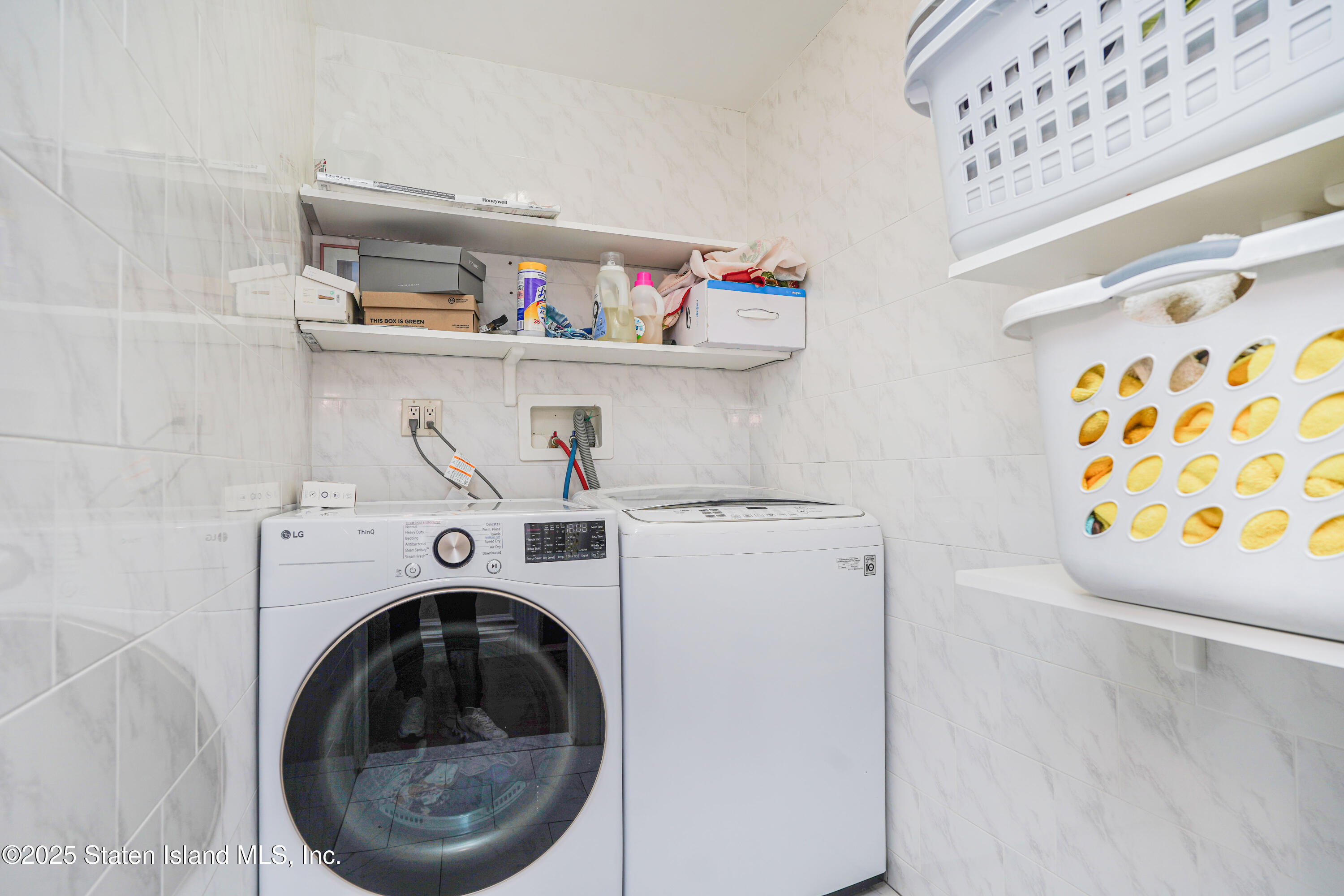 44 Zephyr Avenue Staten Island, NY 10312 - Photo 39 of 54 a utility room with dryer and washer
