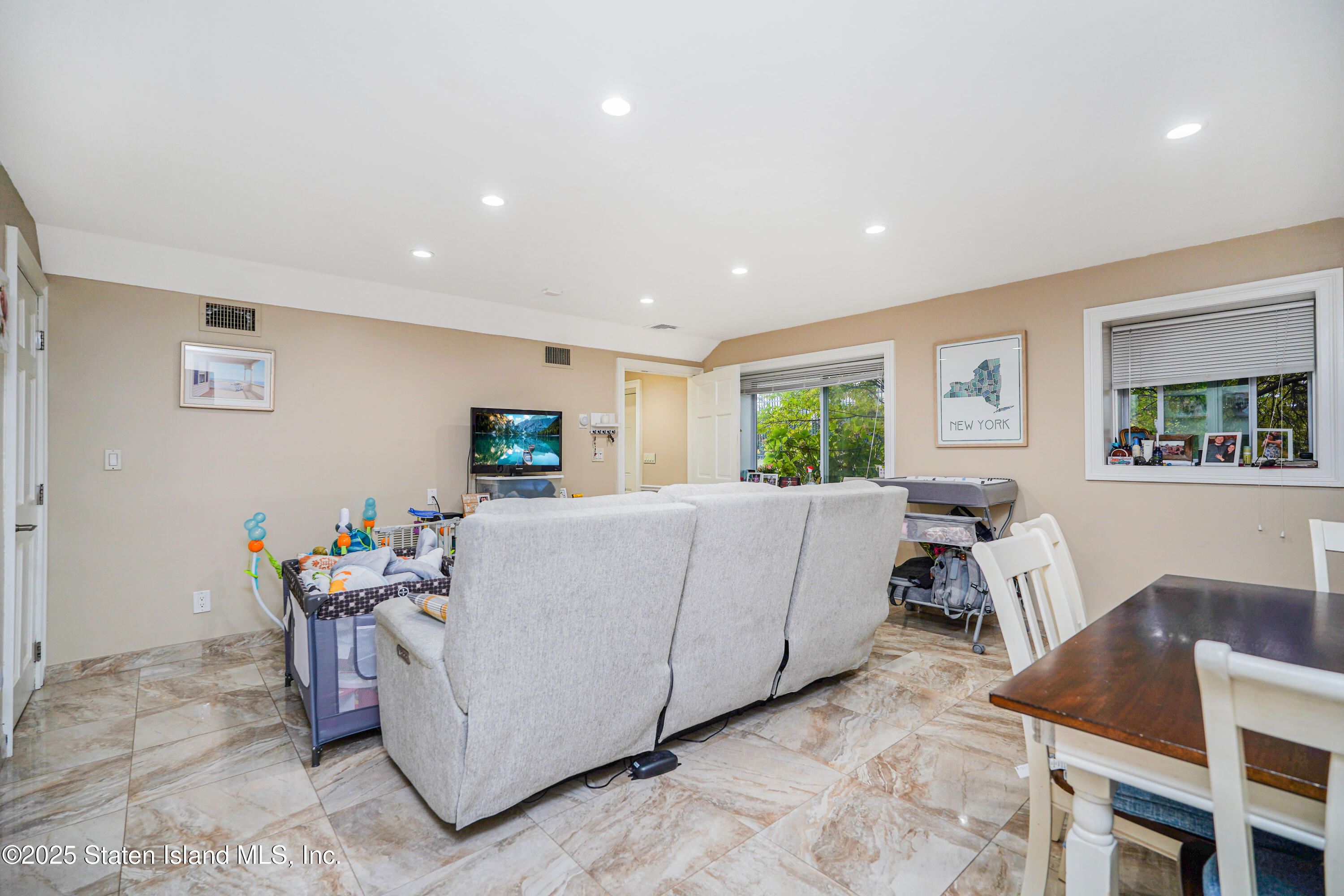 44 Zephyr Avenue Staten Island, NY 10312 - Photo 40 of 54 a living room with furniture and a window