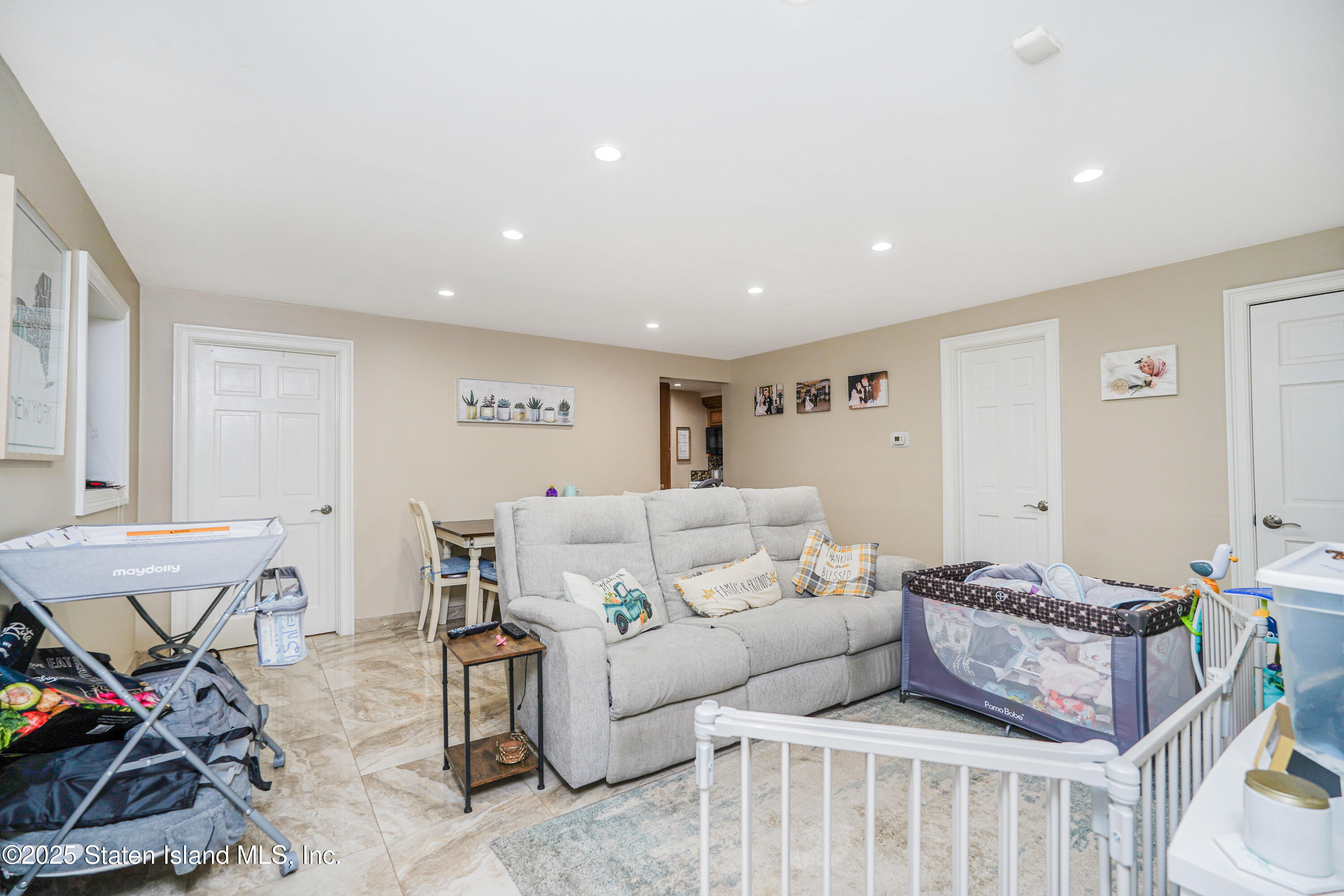 44 Zephyr Avenue Staten Island, NY 10312 - Photo 41 of 54 a living room with furniture and a window