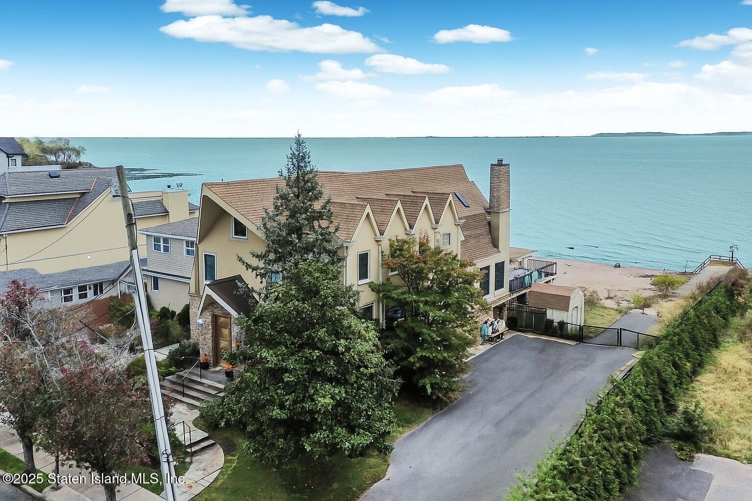 44 Zephyr Avenue Staten Island, NY 10312 - Photo 42 of 54 a front view of a house with a yard