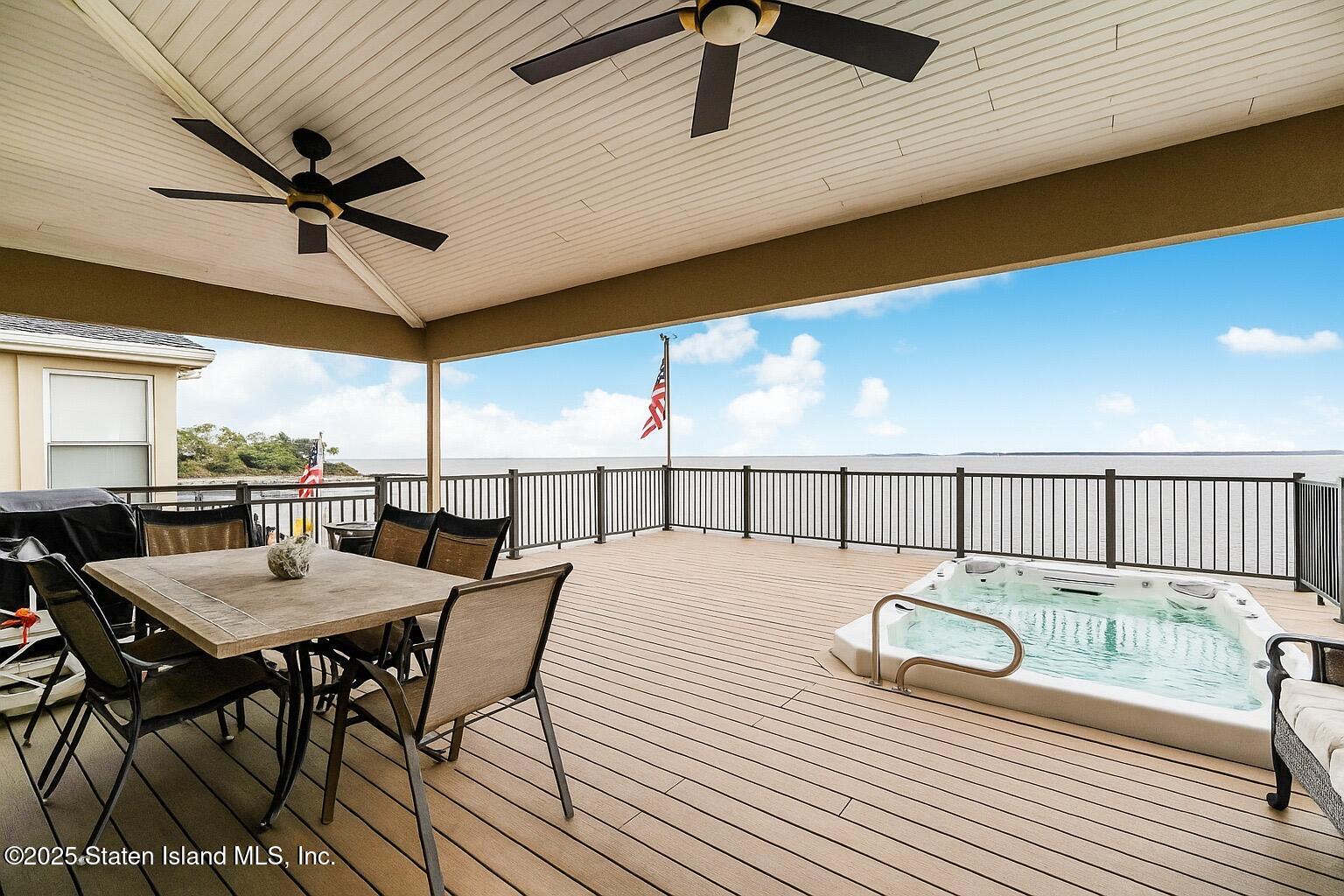 44 Zephyr Avenue Staten Island, NY 10312 - Photo 47 of 54 a roof deck with dining table and chairs