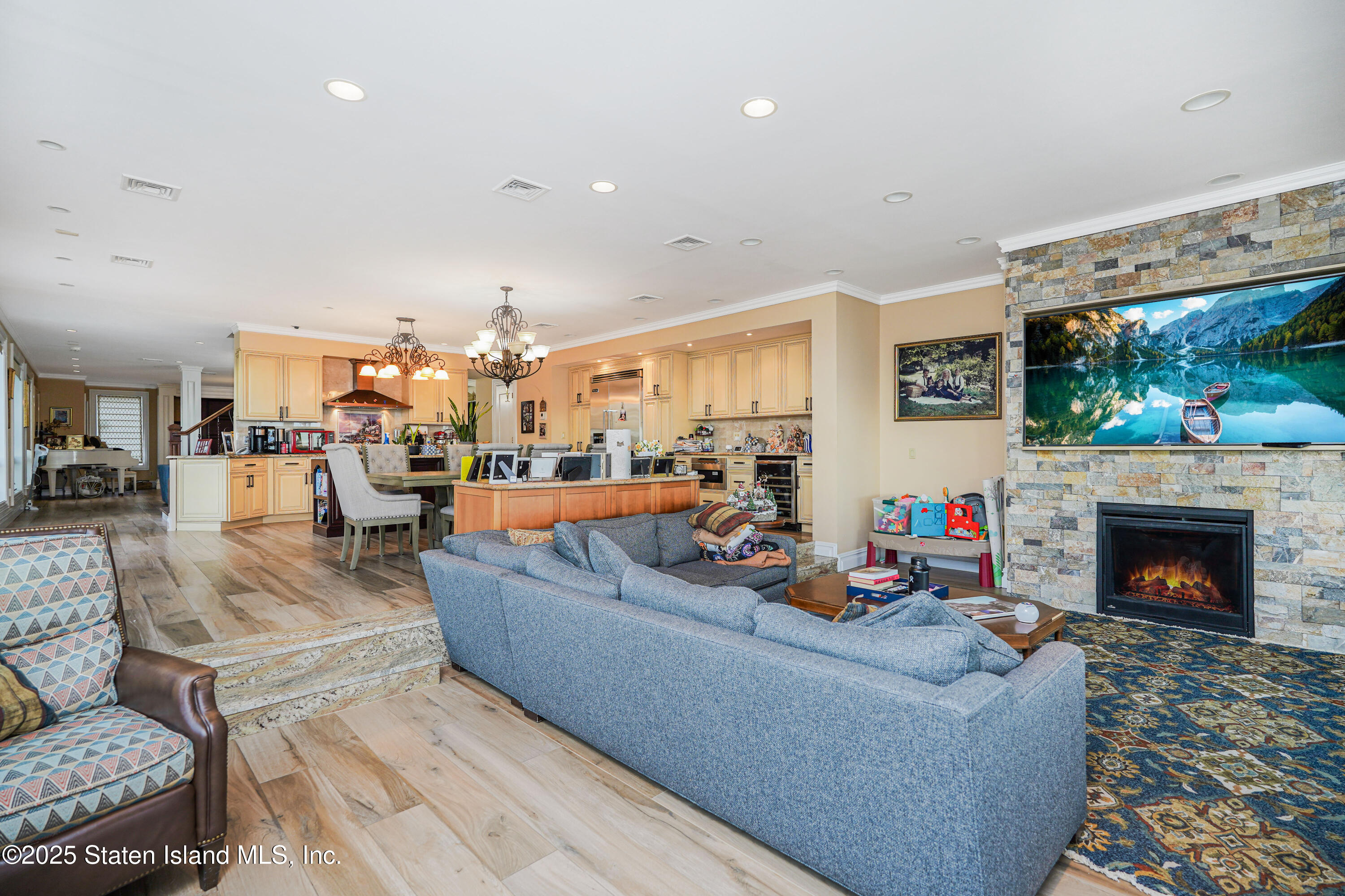44 Zephyr Avenue Staten Island, NY 10312 - Photo 5 of 54 a living room with furniture and a fireplace