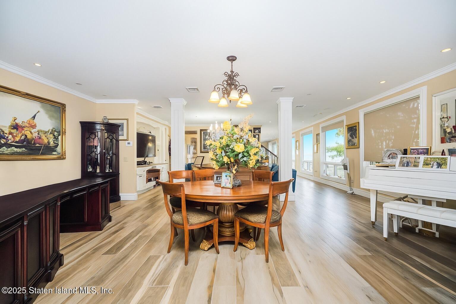44 Zephyr Avenue Staten Island, NY 10312 - Photo 7 of 54 a view of a dining room with furniture window and wooden floor