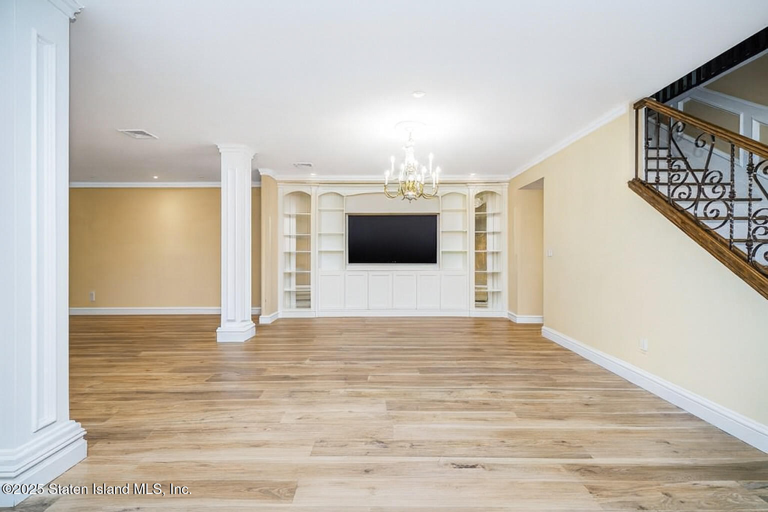 44 Zephyr Avenue Staten Island, NY 10312 - Photo 8 of 54 a view of a hallway with wooden floor and staircase