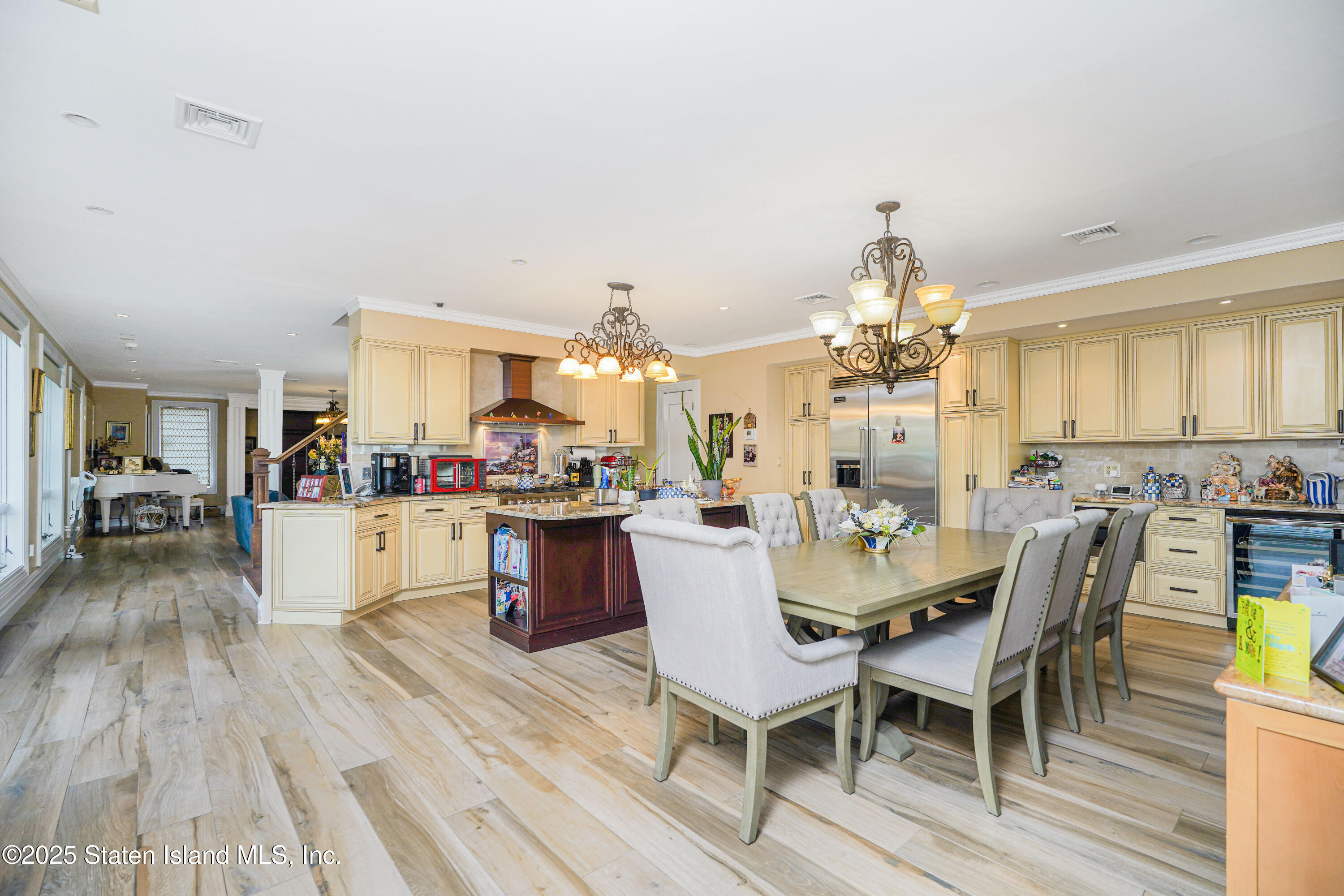44 Zephyr Avenue Staten Island, NY 10312 - Photo 10 of 54 a view of a dining room with furniture and wooden floor