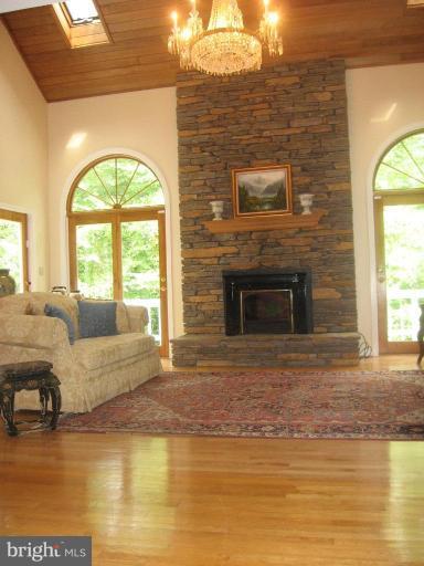 1110 Timber Trail Road Towson, MD 21286 - Photo 13 of 29 Great room with vaulted ceiling, & cozy fireplace