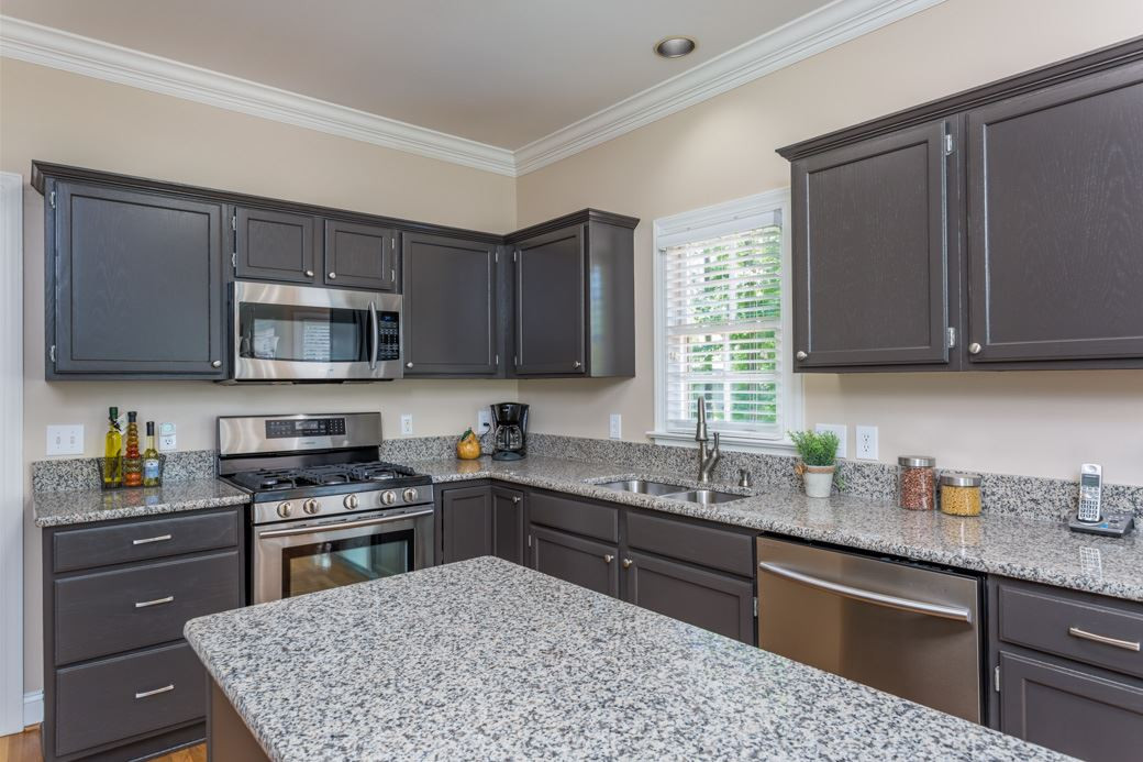 Beautiful updates in the kitchen include new GRANITE counters, STAINLESS STEEL appliances and fresh paint throughout. Gorgeous HARDWOODS throughout formal areas. Freshly painted; move in ready! Kitchen