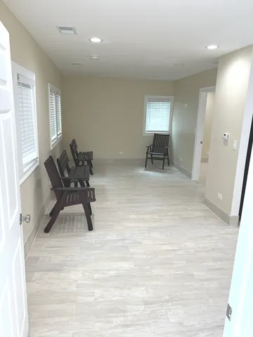 a kitchen with granite countertop a refrigerator stove top oven and sink