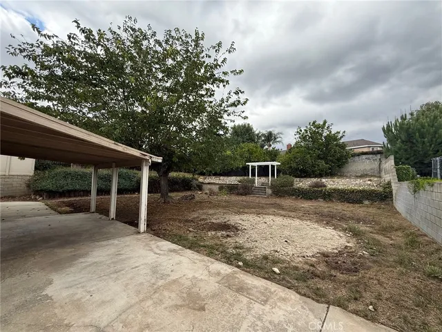 a view of backyard with trampoline