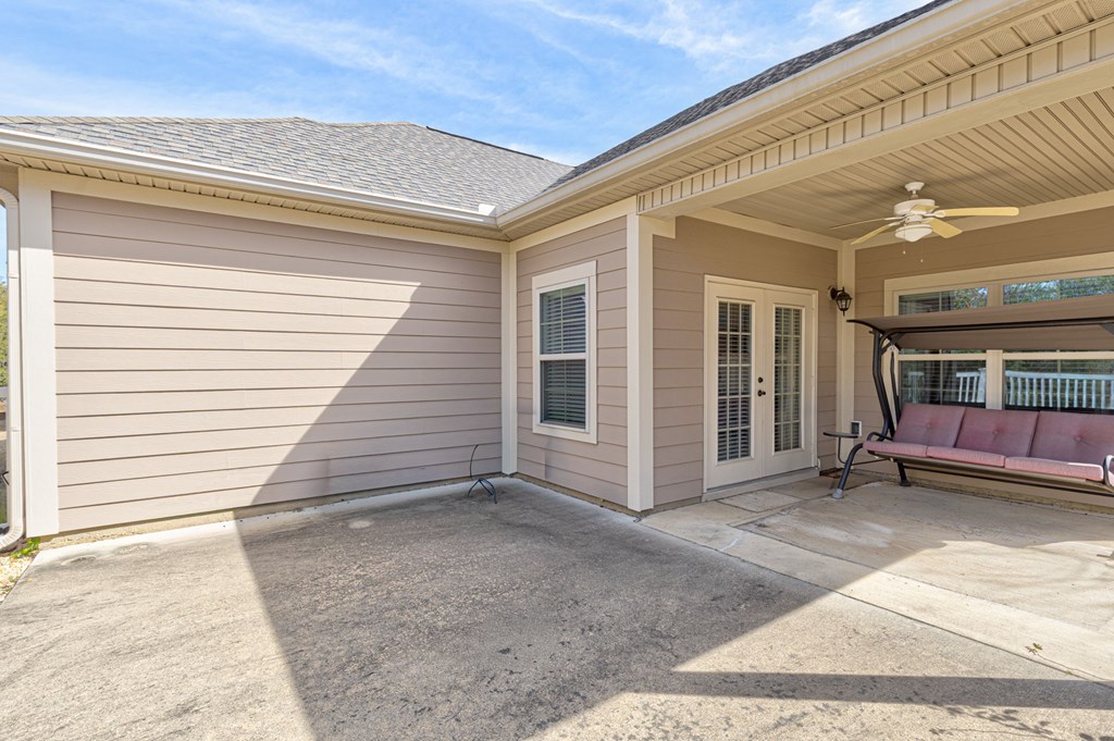 8890 Promenade Place Midland, GA 31820 - Photo 19 of 37 a view of a porch with a table and chairs