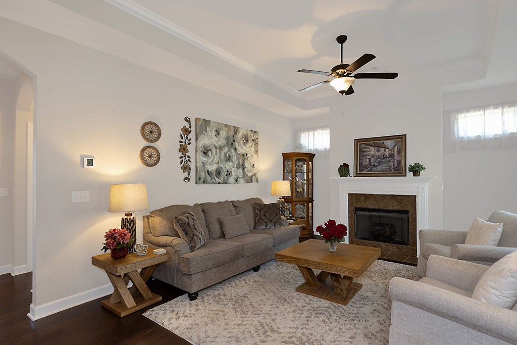 8890 Promenade Place Midland, GA 31820 - Photo 3 of 37 a living room with furniture and a fireplace