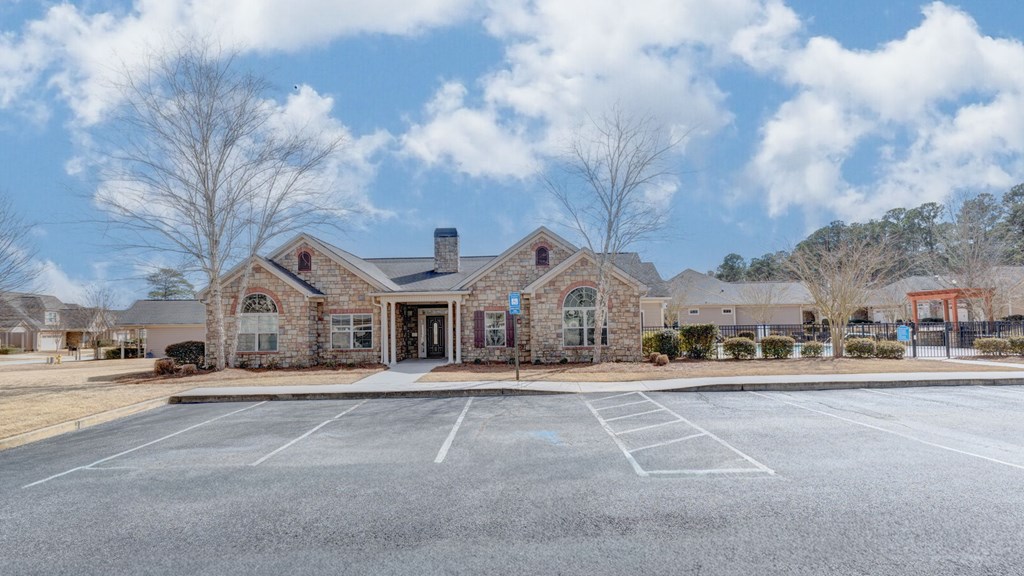 8890 Promenade Place Midland, GA 31820 - Photo 37 of 37 a front view of a building with lot of cars and trees