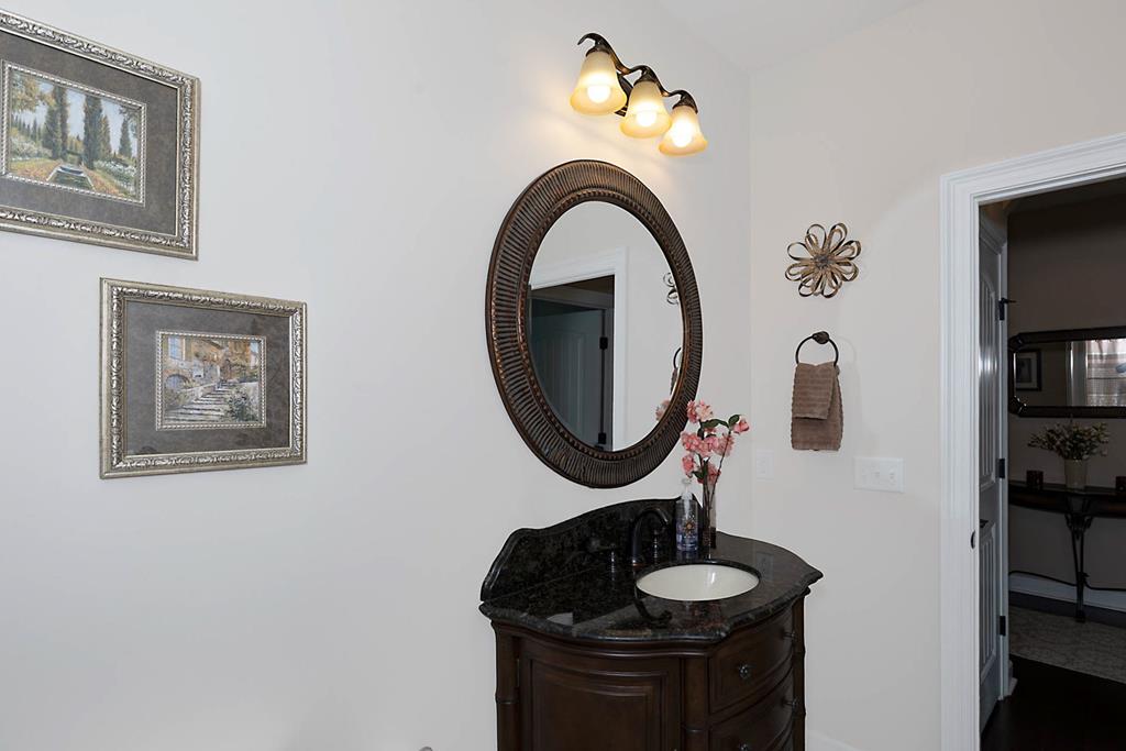 8890 Promenade Place Midland, GA 31820 - Photo 10 of 37 a bathroom with a toilet and a mirror
