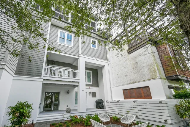 a view of a brick house with many windows