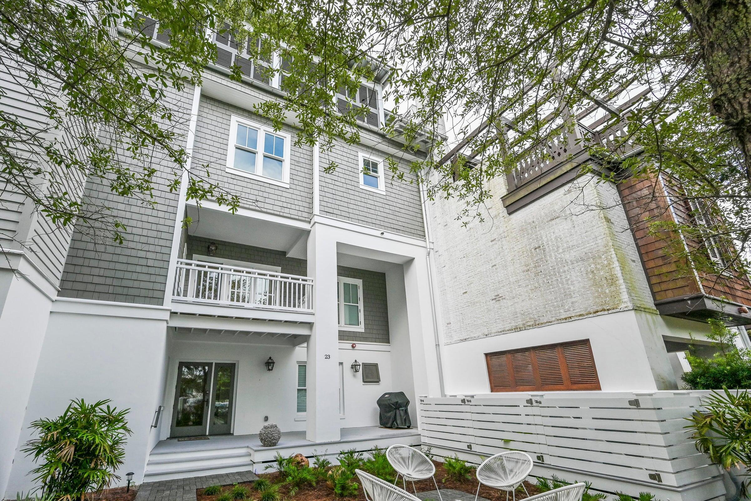 a view of a brick house with many windows