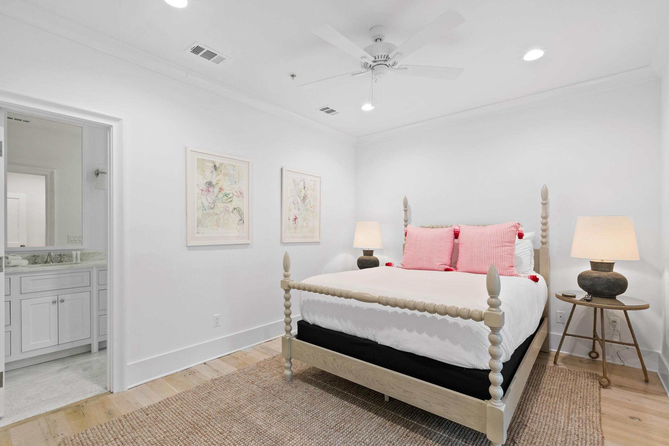 23 Johnstown Lane Inlet Beach, FL 32461 - Photo 14 of 35 a bedroom with a large bed and a chandelier