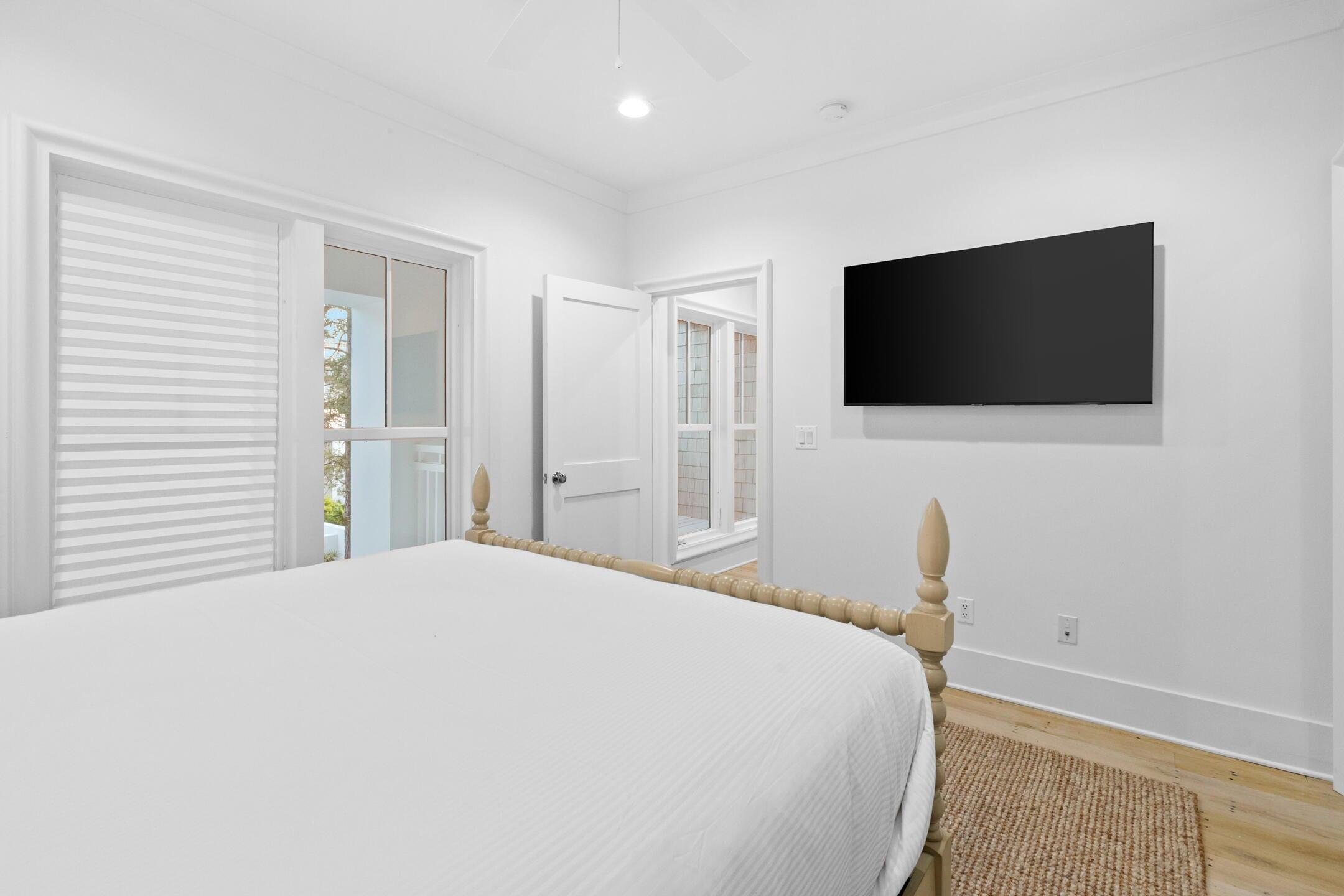 23 Johnstown Lane Inlet Beach, FL 32461 - Photo 15 of 35 a bedroom with a bed and a flat screen tv