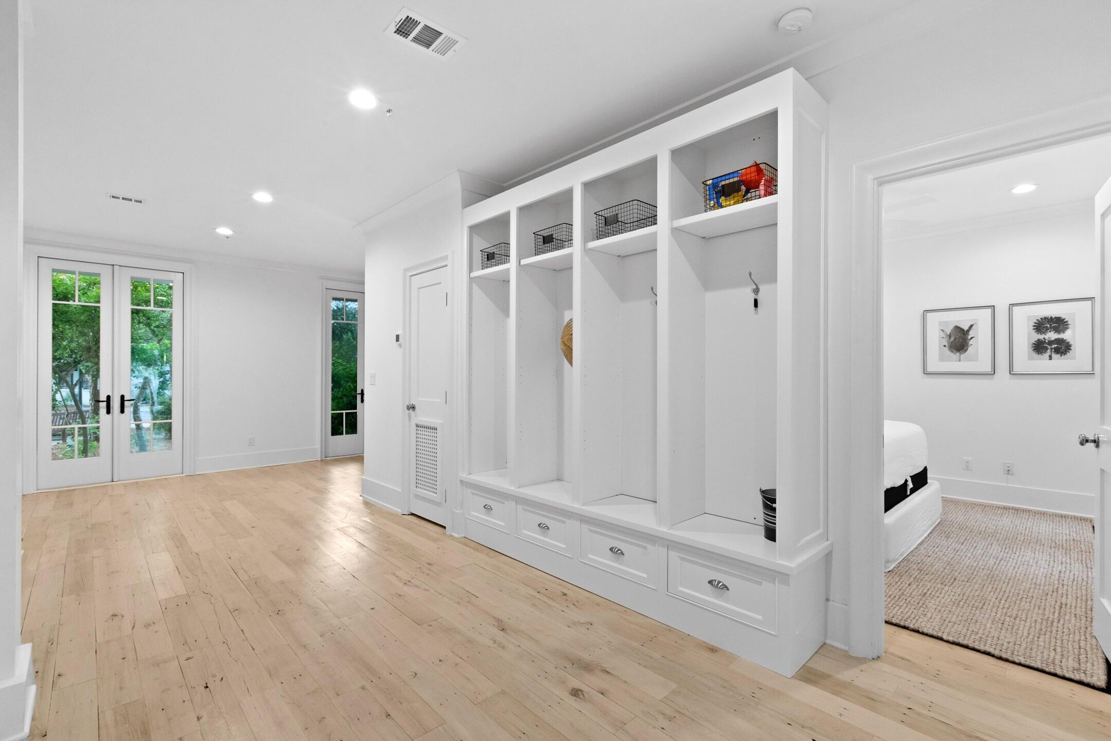 23 Johnstown Lane Inlet Beach, FL 32461 - Photo 31 of 35 an entryway with wooden floor and windows