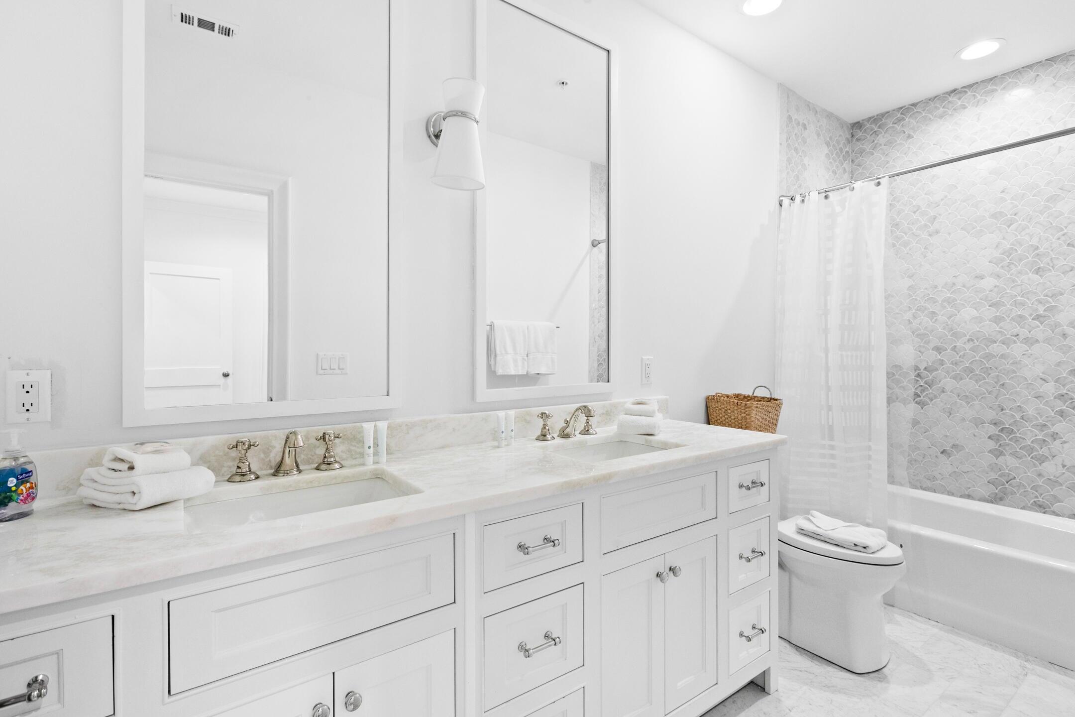 23 Johnstown Lane Inlet Beach, FL 32461 - Photo 8 of 35 a bathroom with a granite countertop sink a toilet and a bathtub