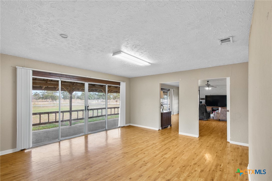1720 Lower Mission Valley Road Victoria, TX 77905 - Photo 11 of 30 a view of empty room with wooden floor and cabinet