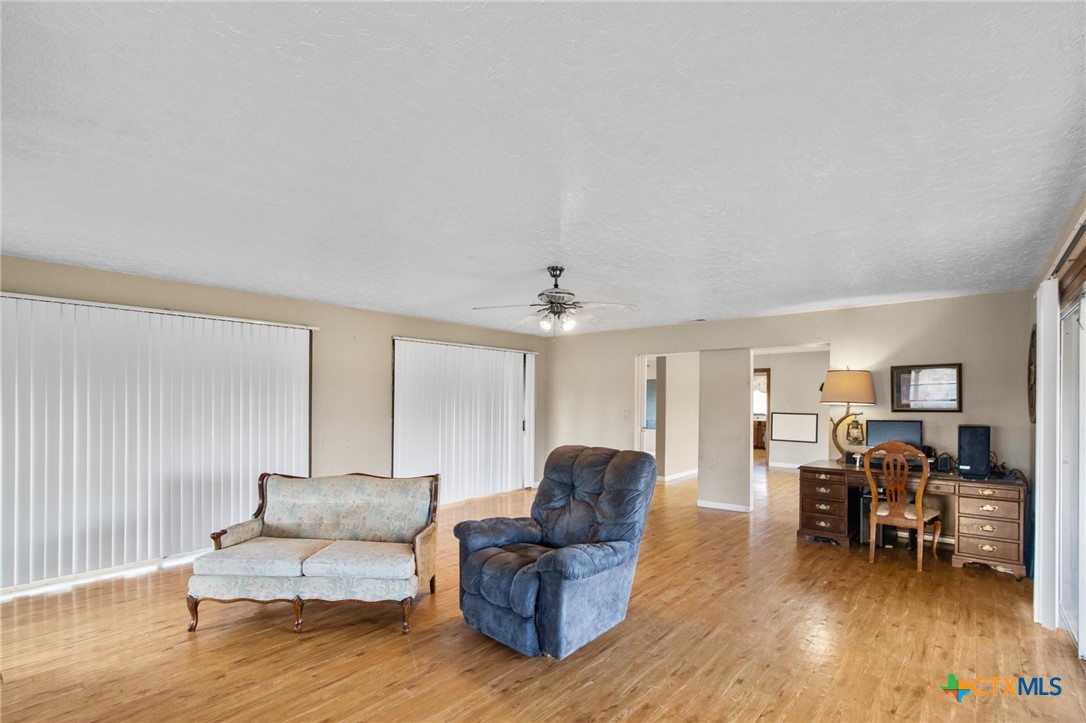 1720 Lower Mission Valley Road Victoria, TX 77905 - Photo 12 of 30 a living room with furniture and a wooden floor