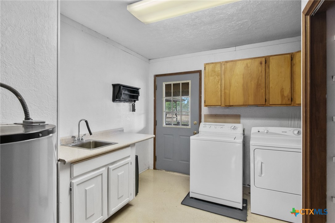 1720 Lower Mission Valley Road Victoria, TX 77905 - Photo 14 of 30 a kitchen with a sink stove and refrigerator