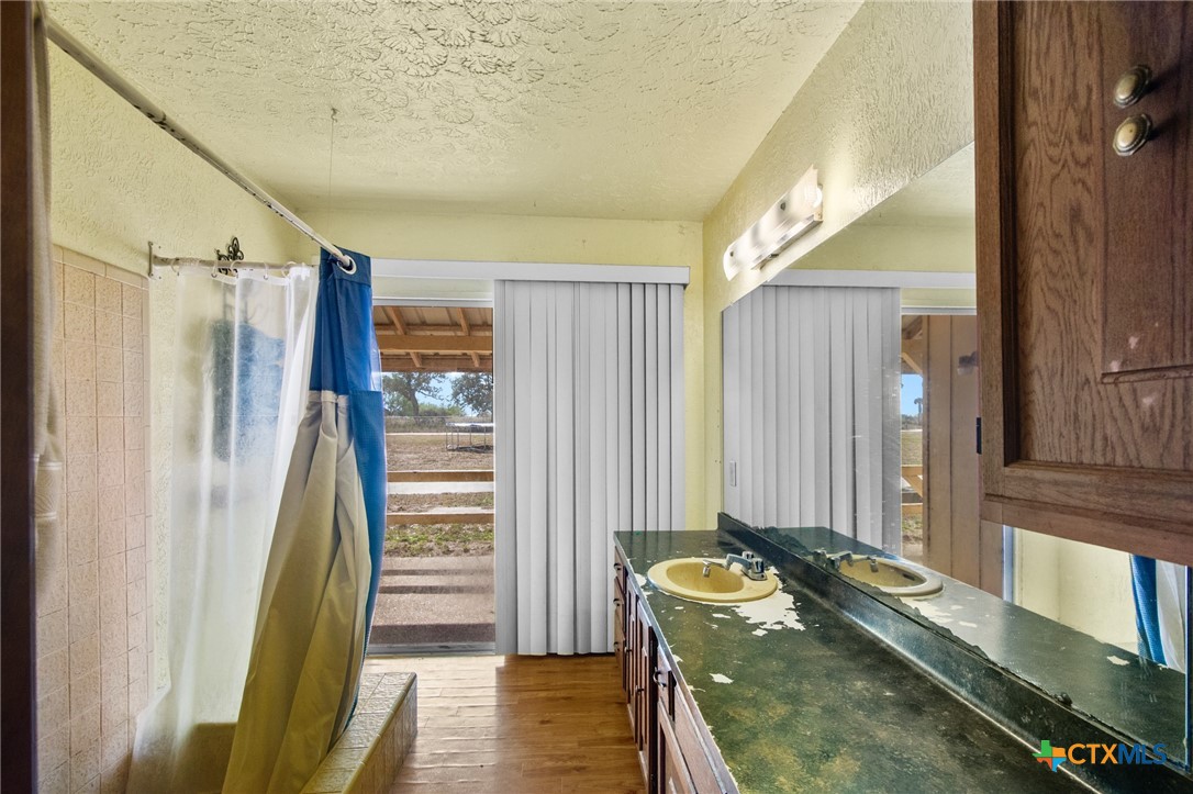 1720 Lower Mission Valley Road Victoria, TX 77905 - Photo 18 of 30 a bed room with a bed and a window