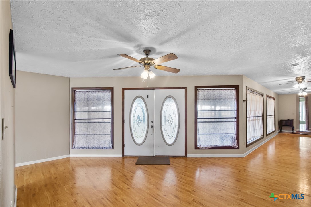 1720 Lower Mission Valley Road Victoria, TX 77905 - Photo 2 of 30 a view of a livingroom with wooden floor