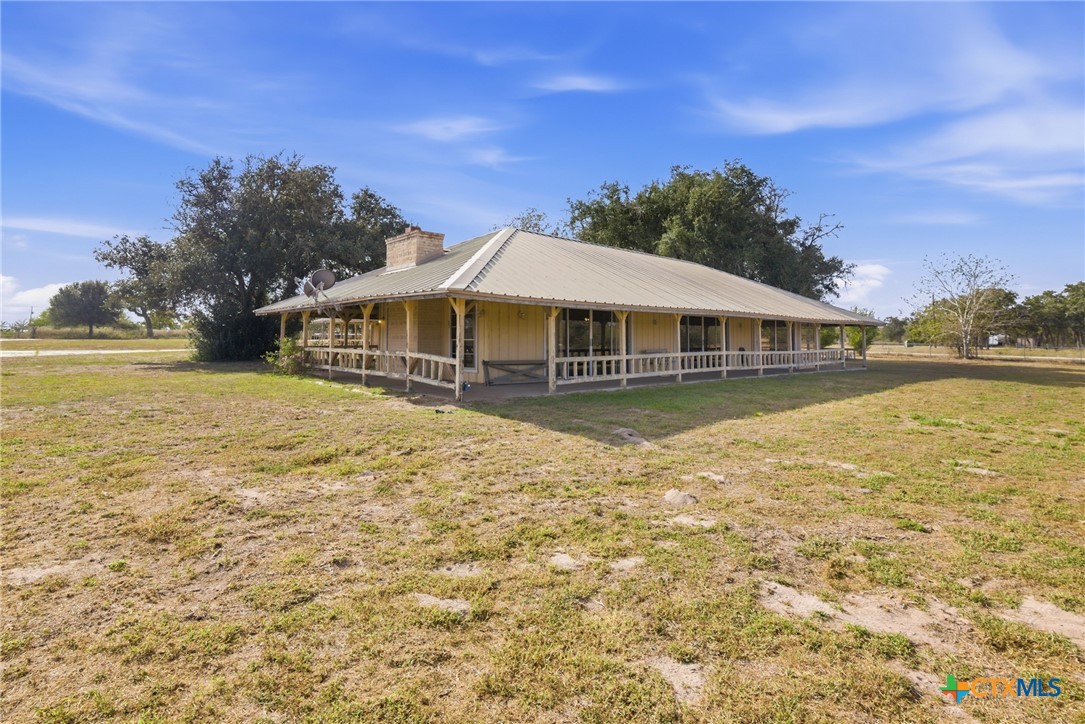 1720 Lower Mission Valley Road Victoria, TX 77905 - Photo 21 of 30 a view of a house with swimming pool and a yard