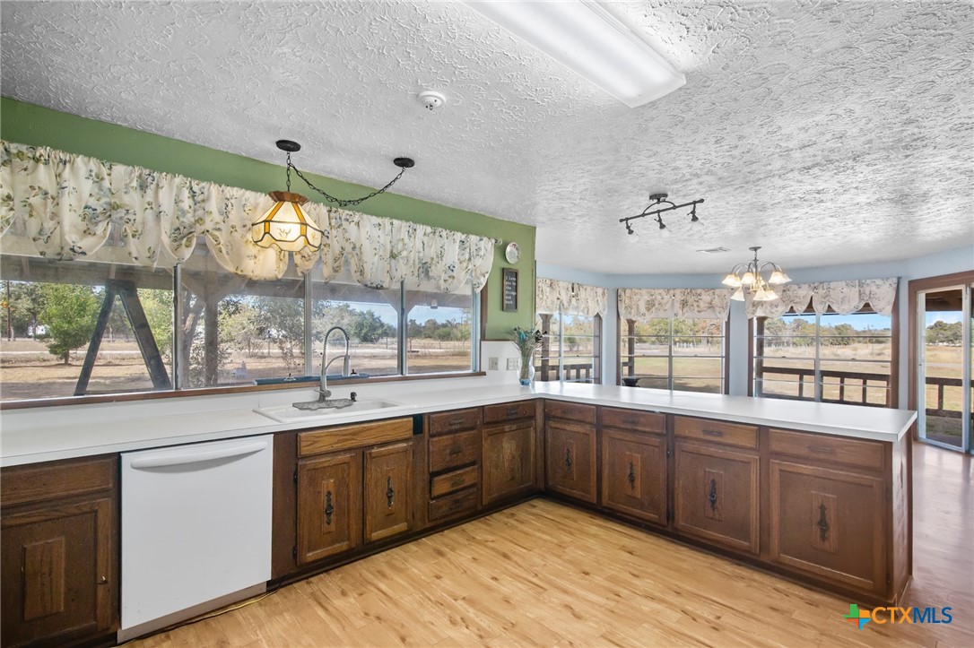 1720 Lower Mission Valley Road Victoria, TX 77905 - Photo 4 of 30 a kitchen with a sink window and cabinets