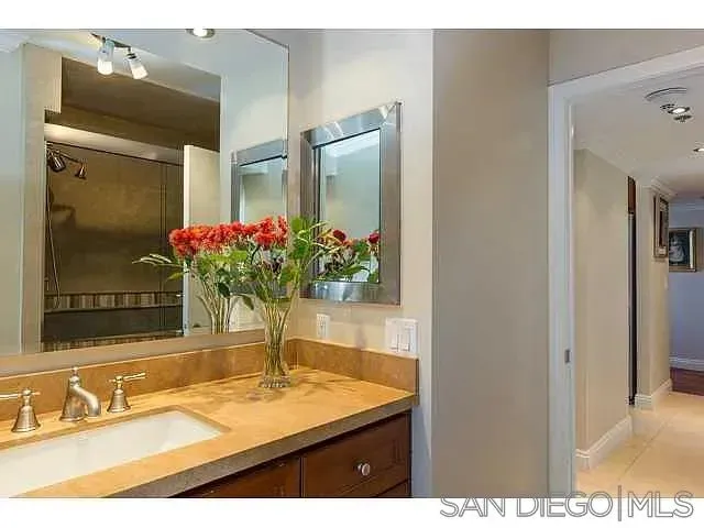 a bathroom with a sink and a mirror